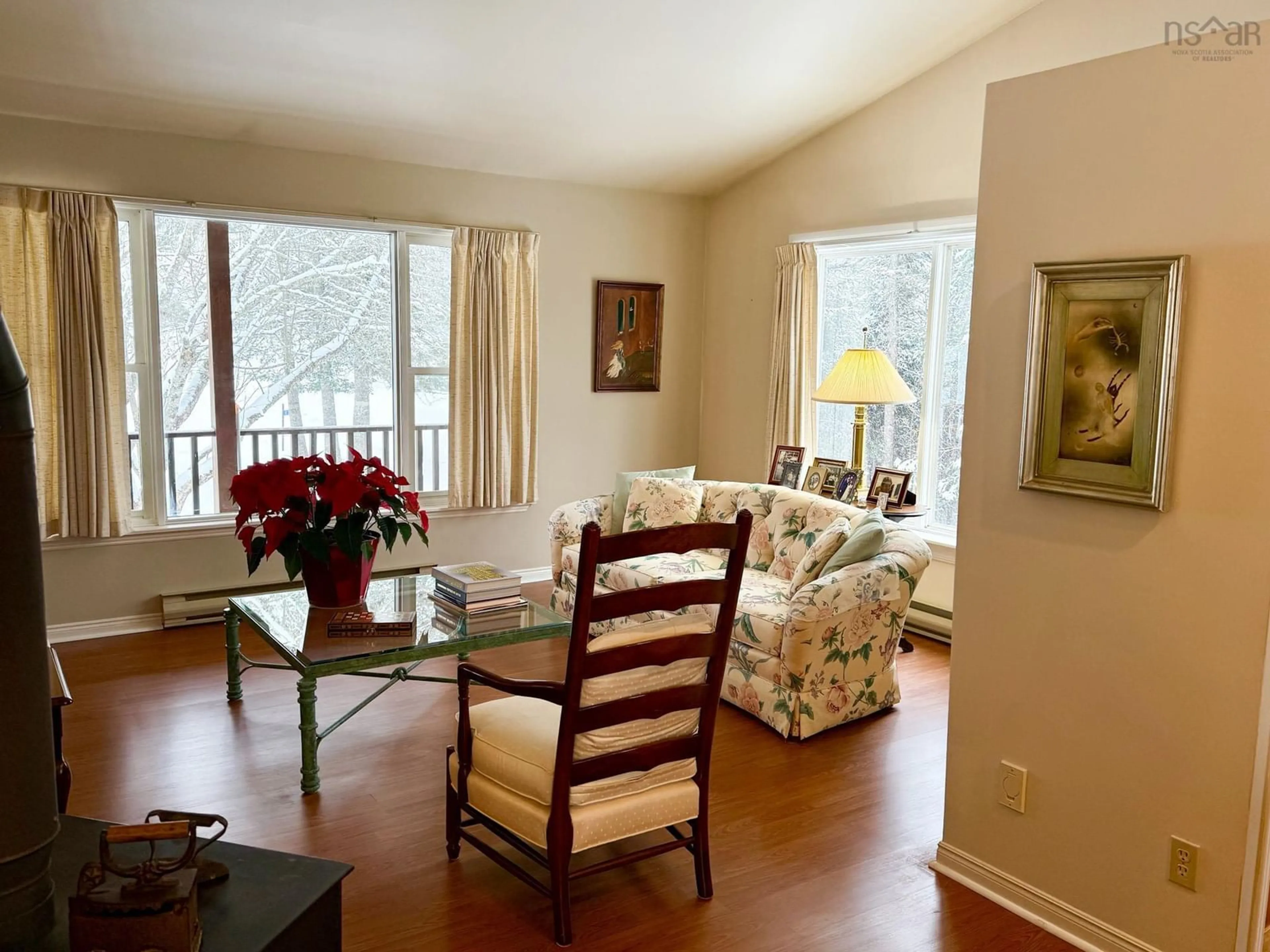 Living room with furniture, wood/laminate floor for 110 Bonavista Ave, Hilden Nova Scotia B0N 1C0