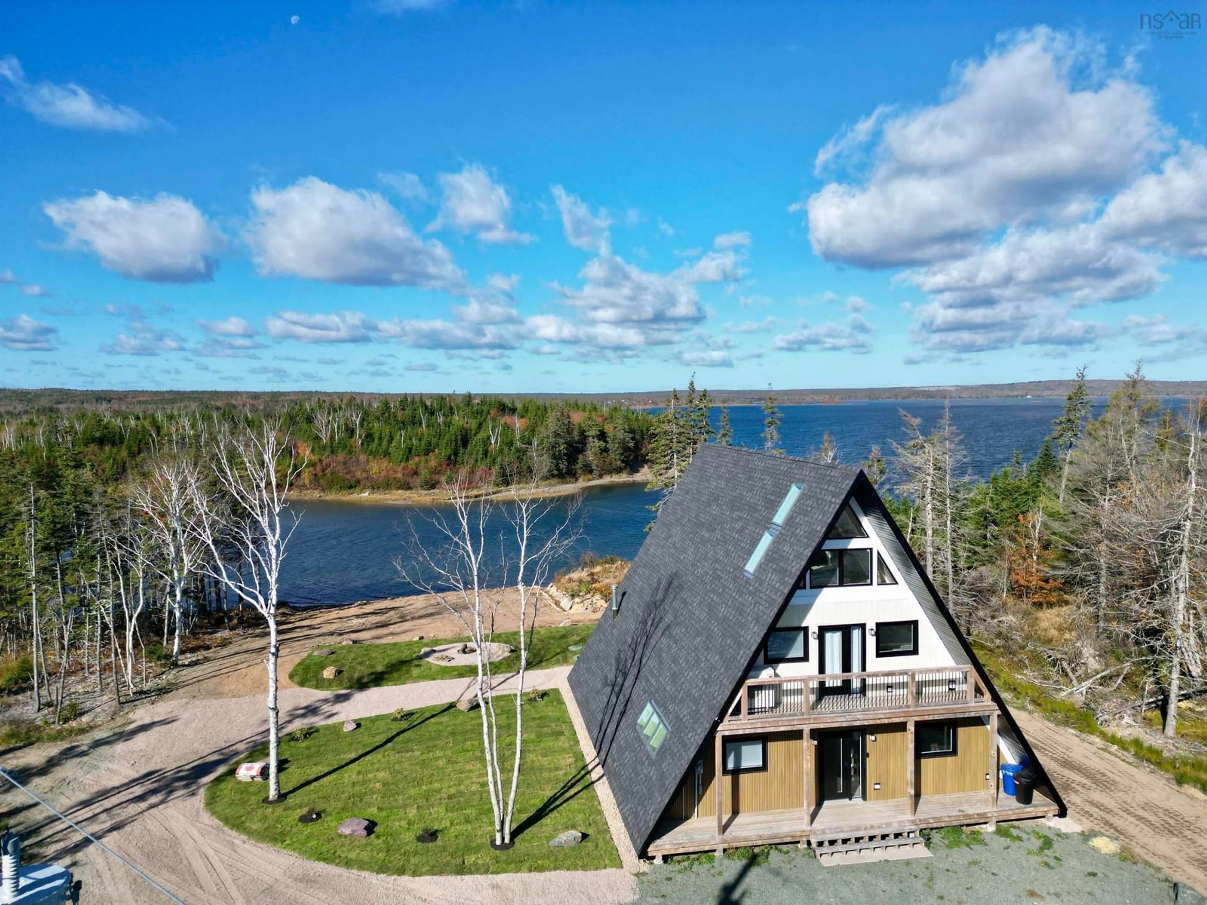 A pic from outside/outdoor area/front of a property/back of a property/a pic from drone, water/lake/river/ocean view for 315 South Head Rd, South Head Nova Scotia B1B 0A1