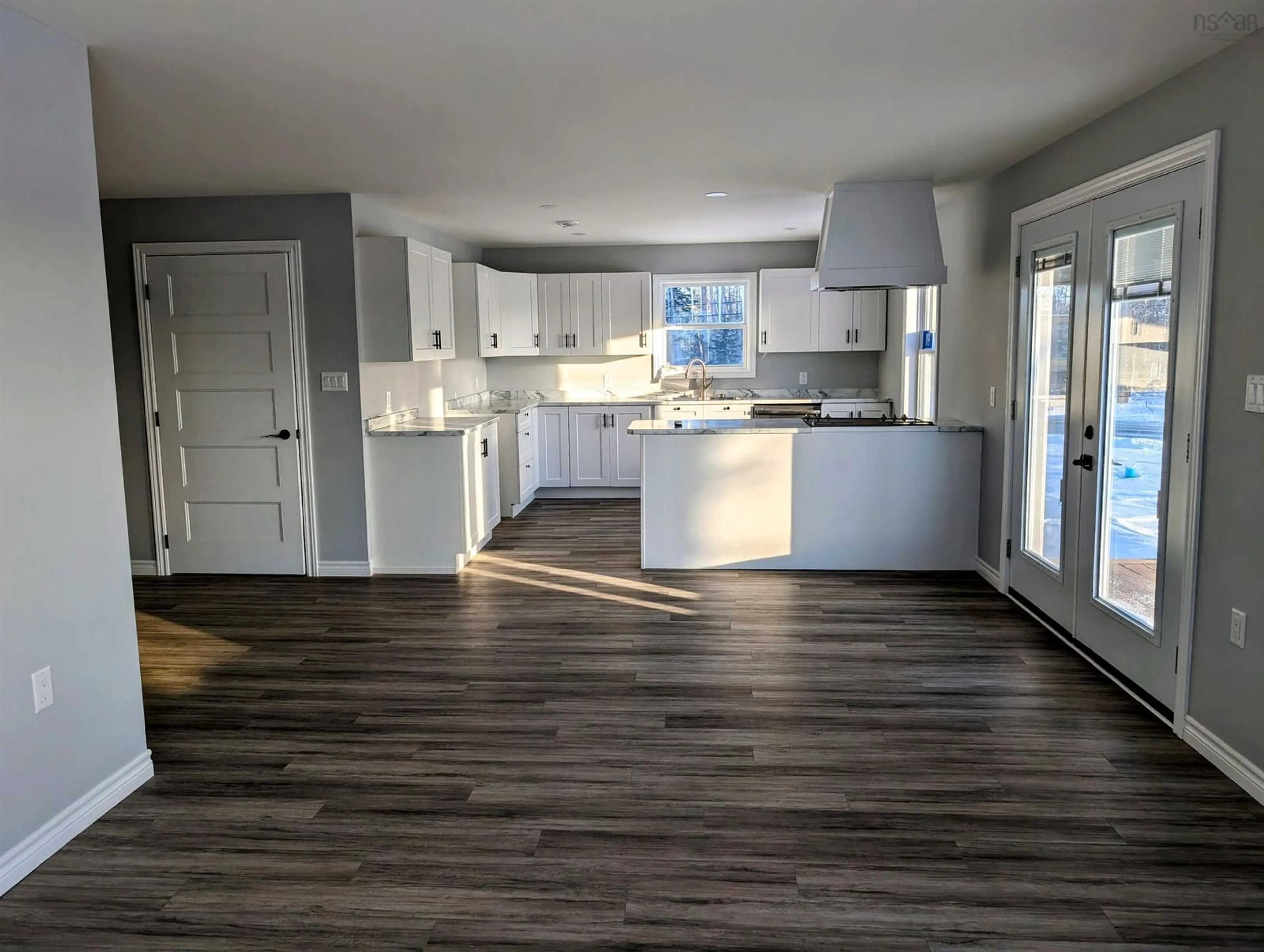 Open concept kitchen, wood/laminate floor for 119 Pine St, Tatamagouche Nova Scotia B0K 1V0