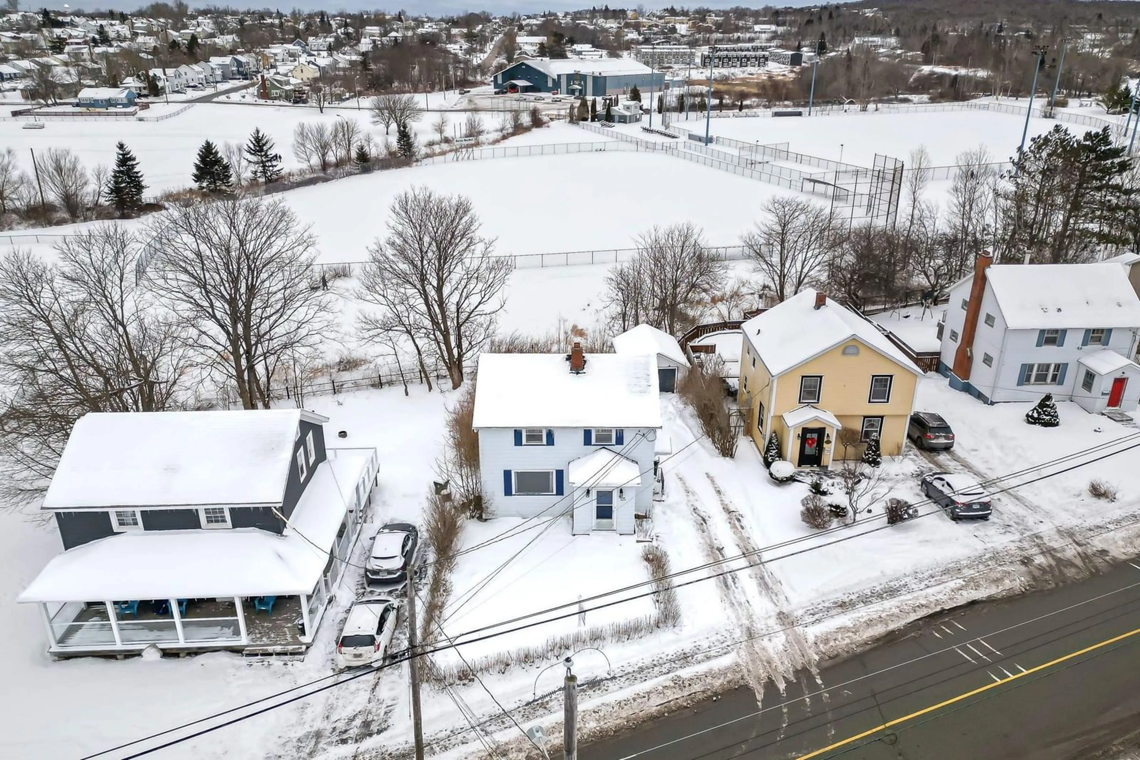 A pic from outside/outdoor area/front of a property/back of a property/a pic from drone, street for 297 Cottage Rd, Sydney Nova Scotia B1P 2E7