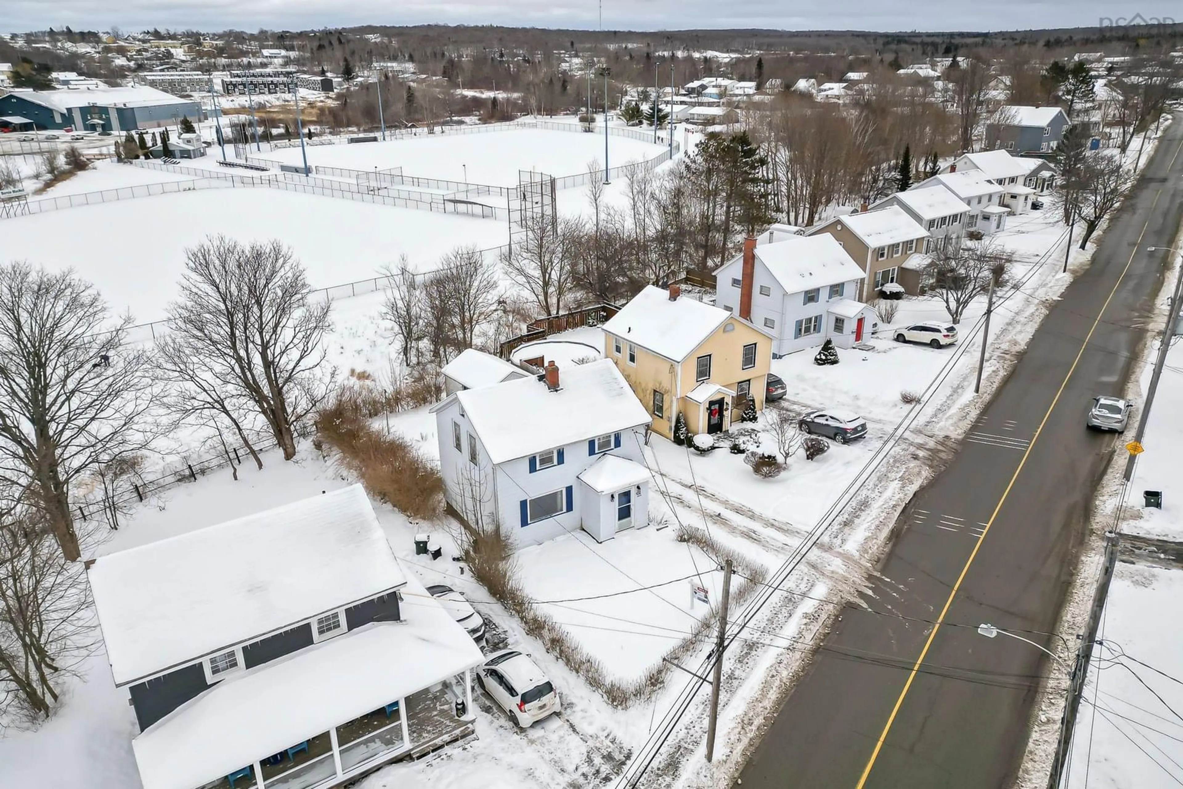 A pic from outside/outdoor area/front of a property/back of a property/a pic from drone, street for 297 Cottage Rd, Sydney Nova Scotia B1P 2E7