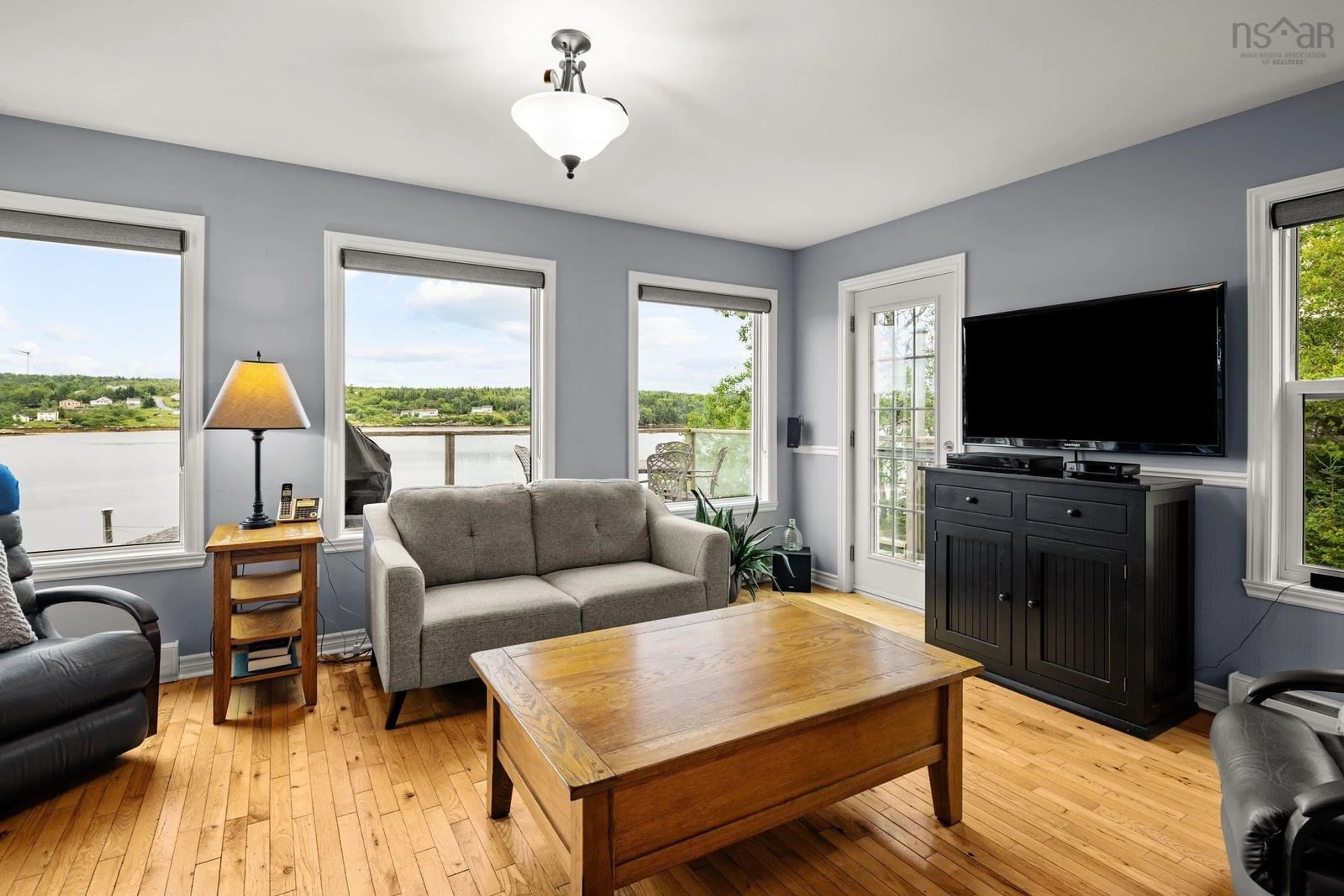 Living room with furniture, wood/laminate floor for 1072 Terence Bay Rd, Terence Bay Nova Scotia B3T 1X5