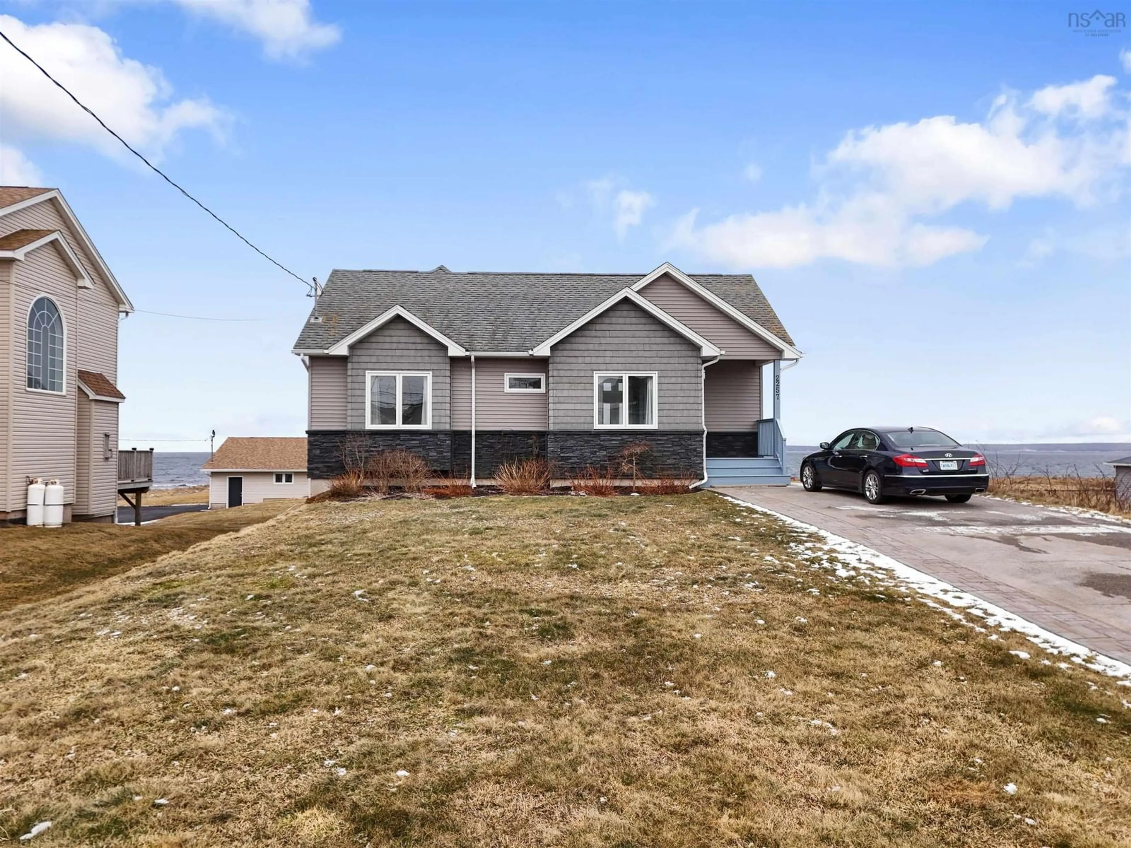 Home with vinyl exterior material, street for 2257 Shore Road, Eastern Passage Nova Scotia B3G 1H6