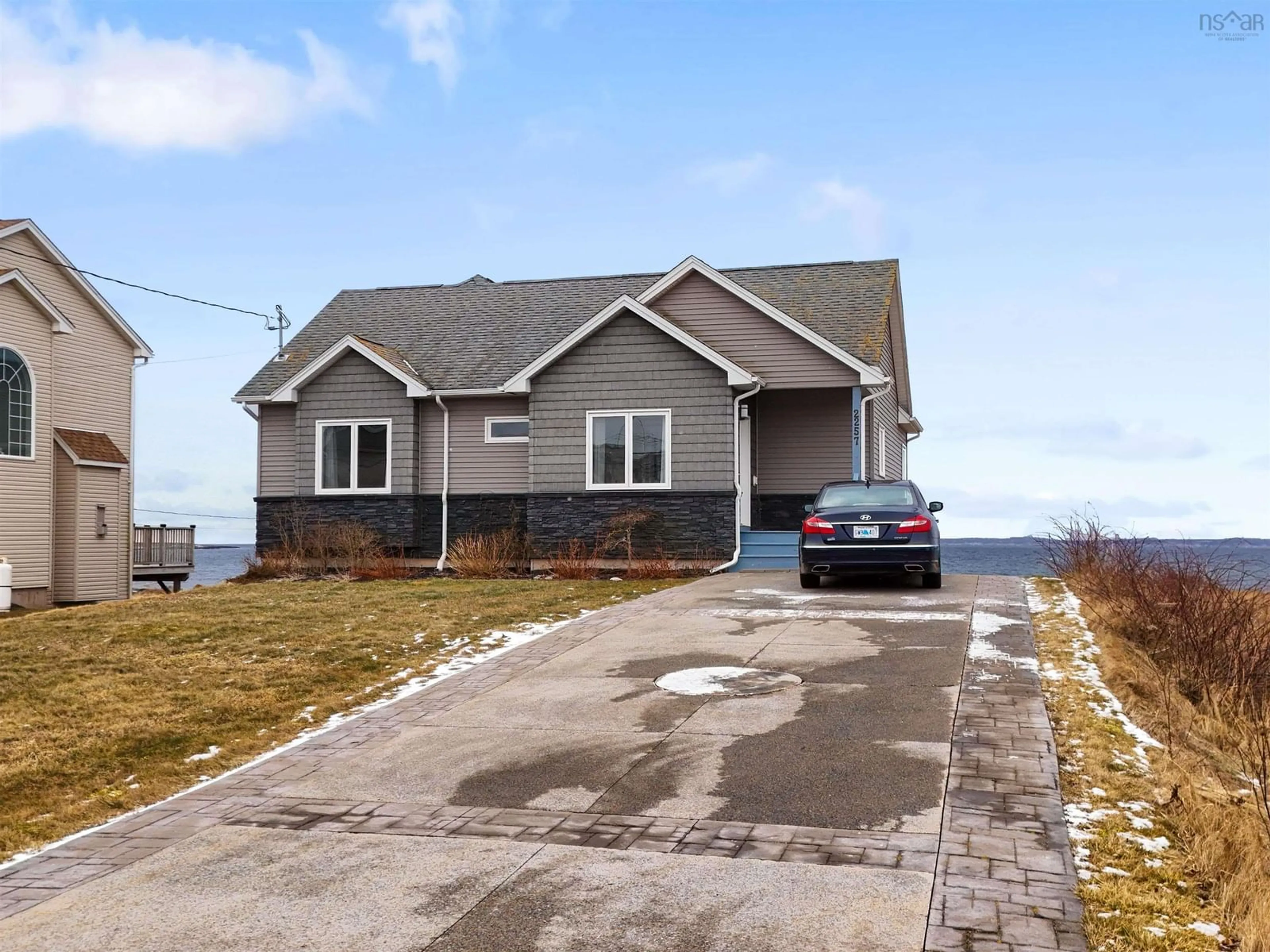 Home with vinyl exterior material, street for 2257 Shore Road, Eastern Passage Nova Scotia B3G 1H6