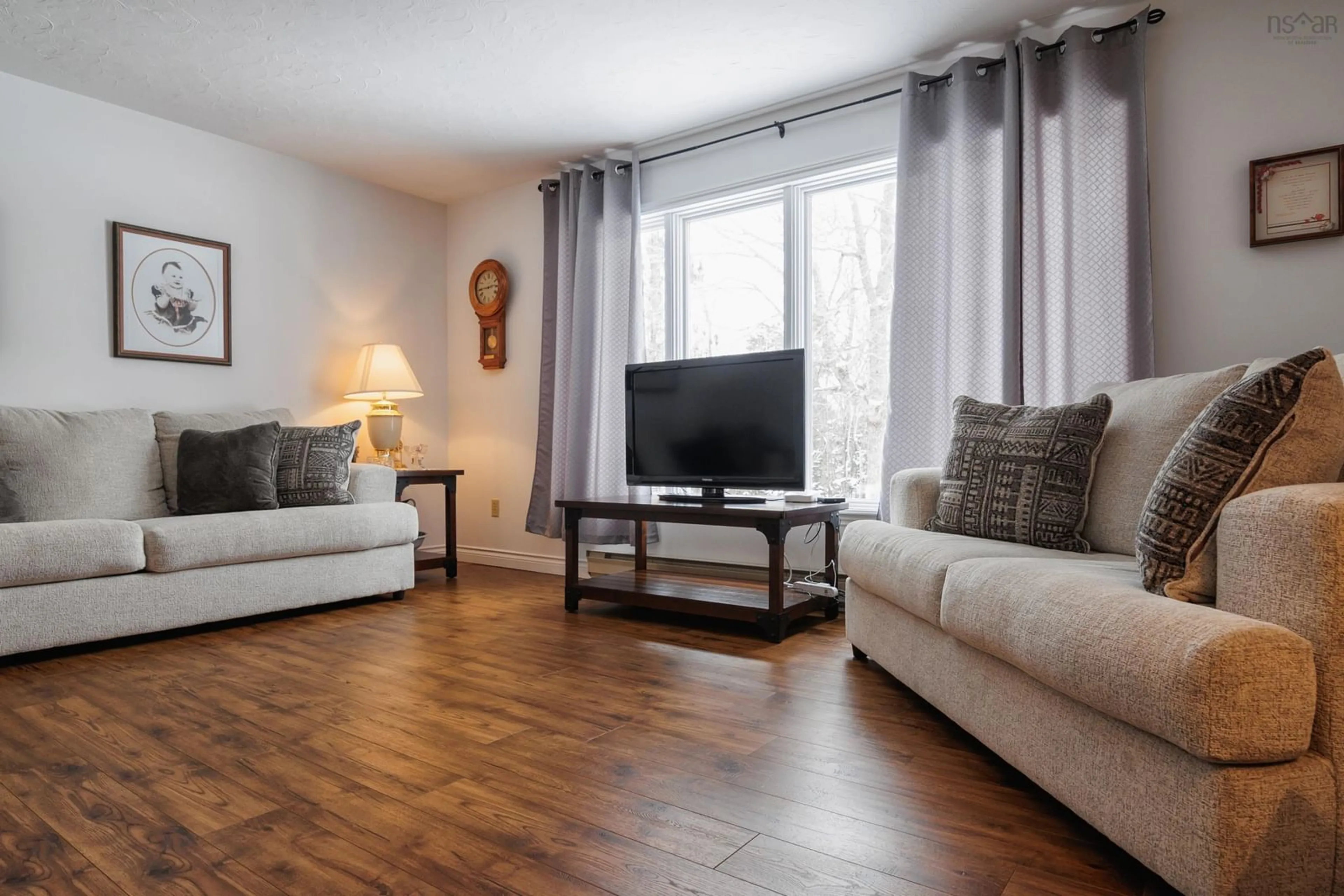 Living room with furniture, wood/laminate floor for 61 Regency Point Dr, Bible Hill Nova Scotia B6L 4B5