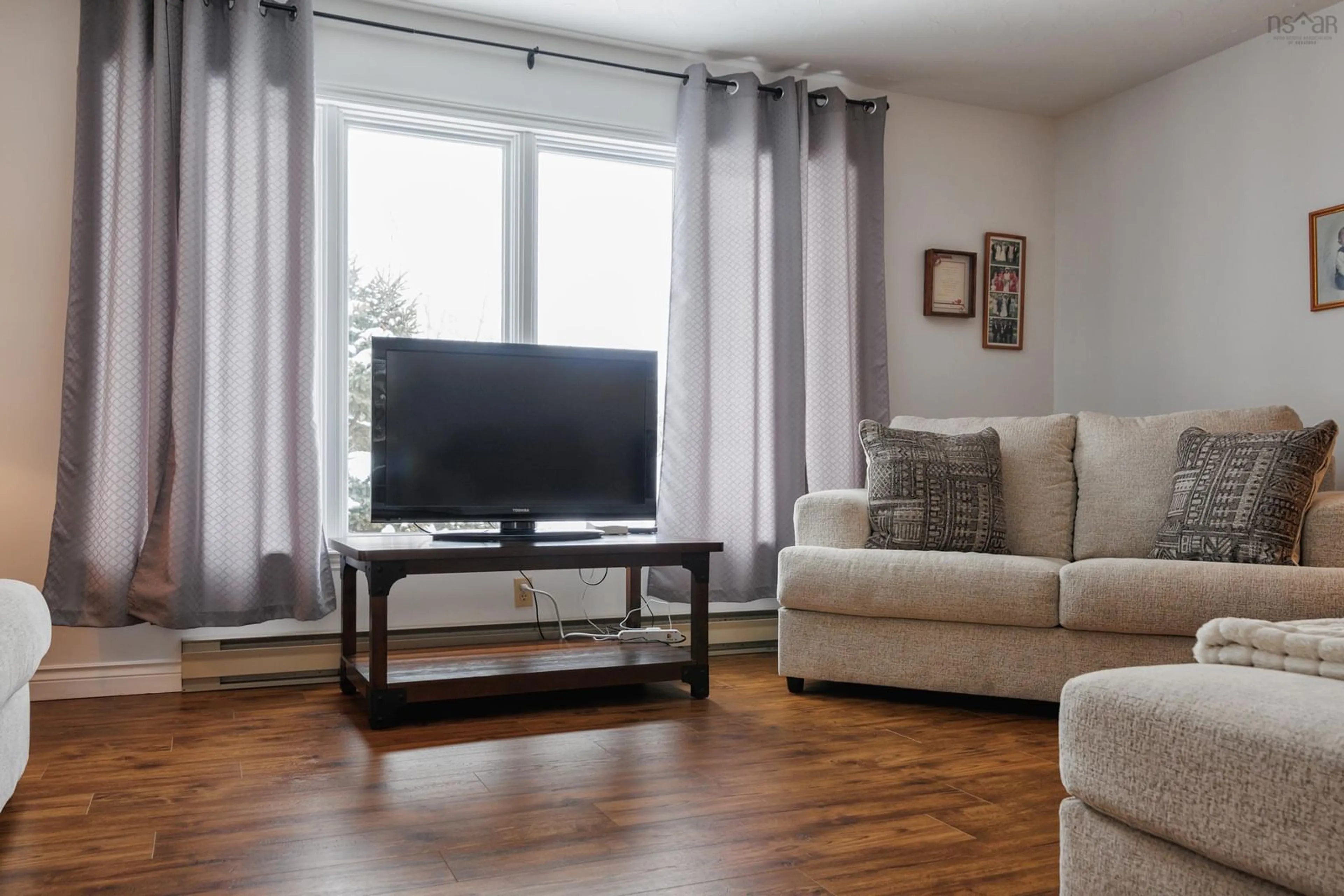 Living room with furniture, wood/laminate floor for 61 Regency Point Dr, Bible Hill Nova Scotia B6L 4B5