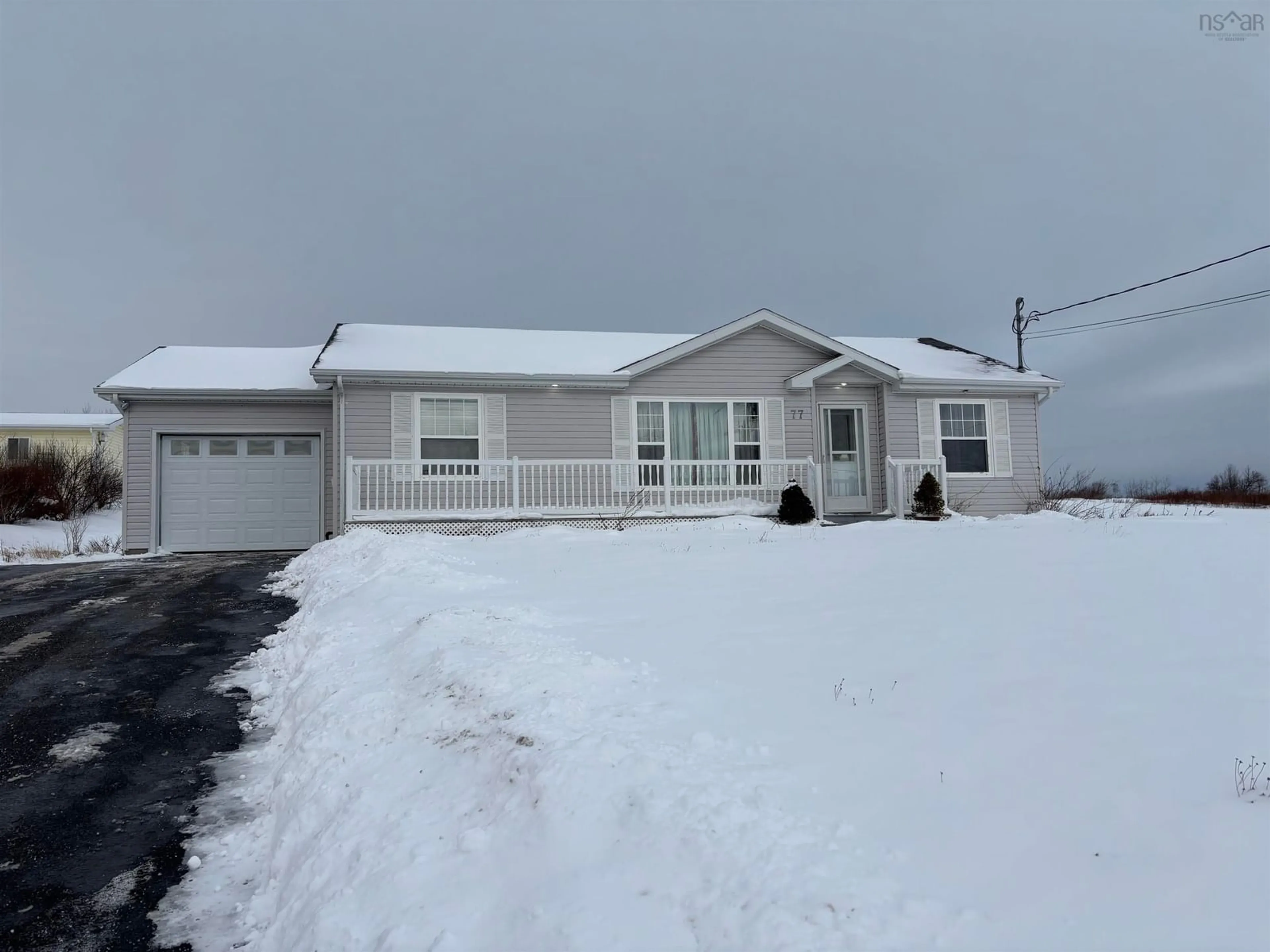 Home with vinyl exterior material, street for 77 Meech Avenue, North Sydney Nova Scotia B2A 1R9