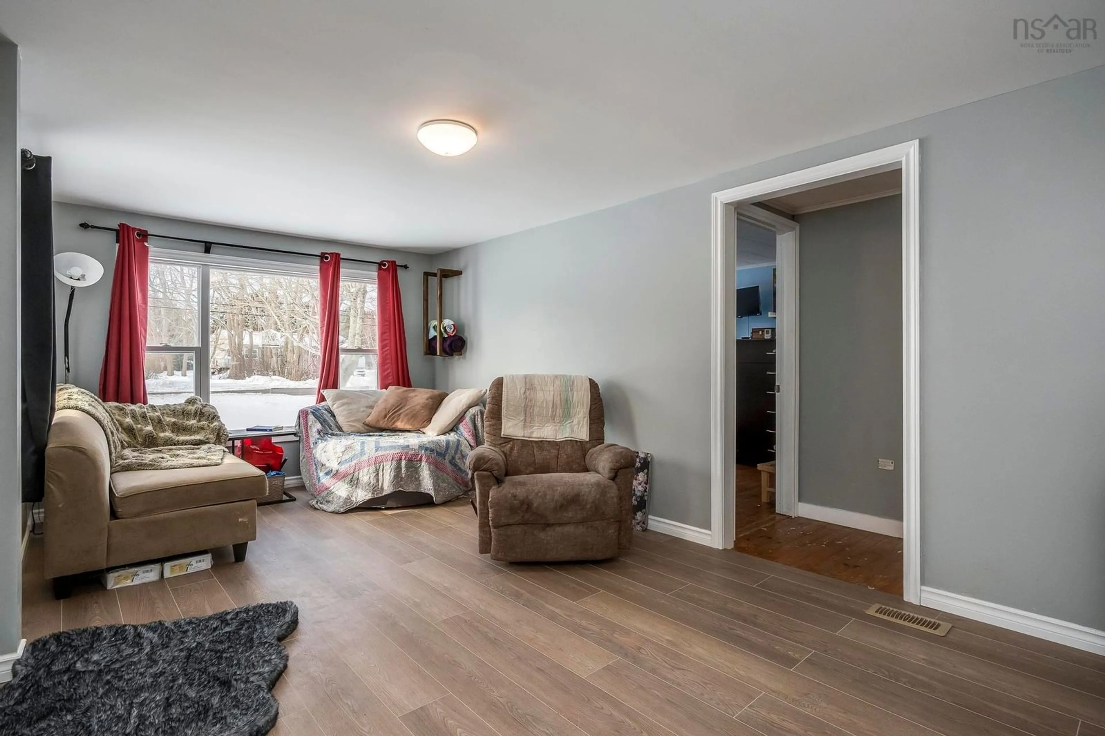 Living room with furniture, wood/laminate floor for 9402 Highway 10, Nictaux Nova Scotia B0S 1P0