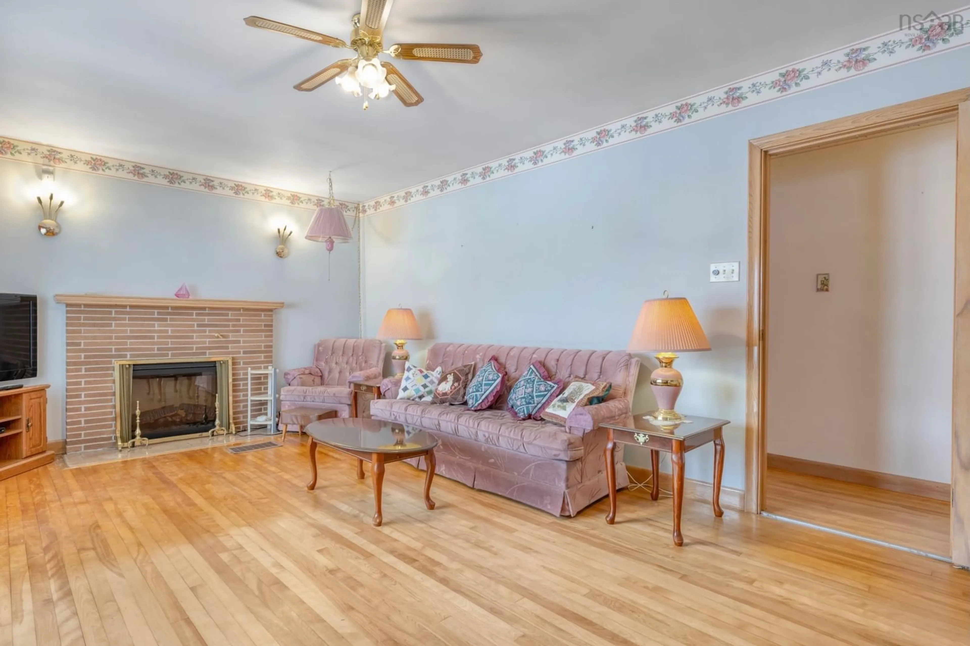 Living room with furniture, wood/laminate floor for 143 Brook St, Lunenburg Nova Scotia B0J 2C0