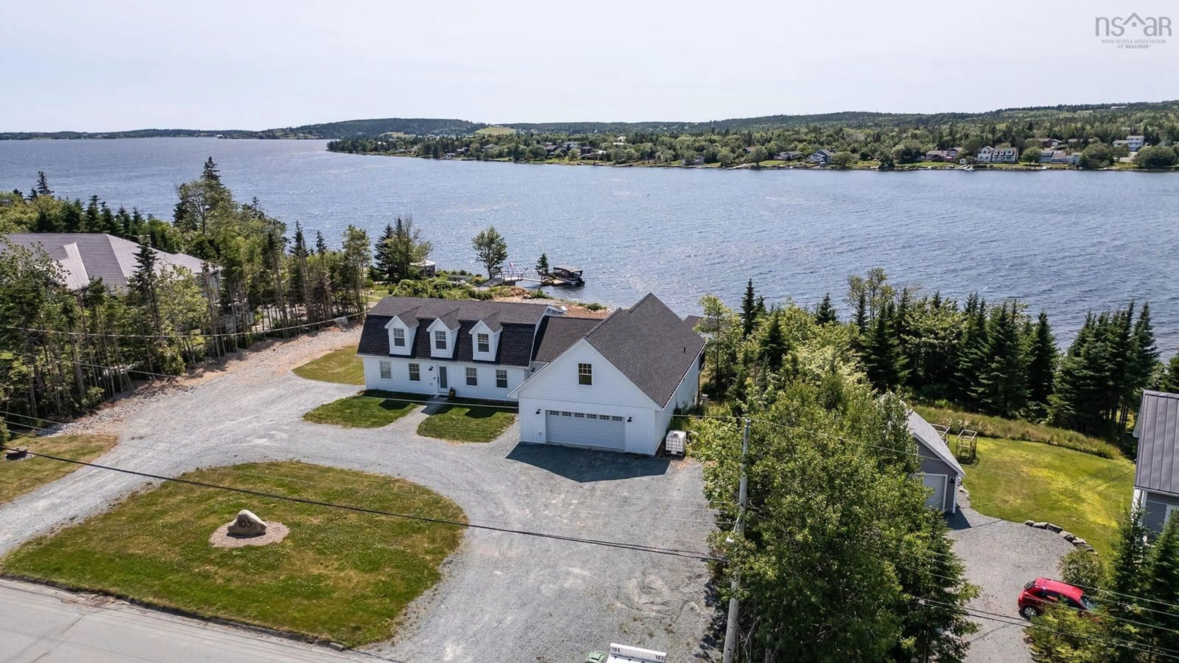 A pic from outside/outdoor area/front of a property/back of a property/a pic from drone, water/lake/river/ocean view for 103 Capri Drive, West Porters Lake Nova Scotia B3E 1L6