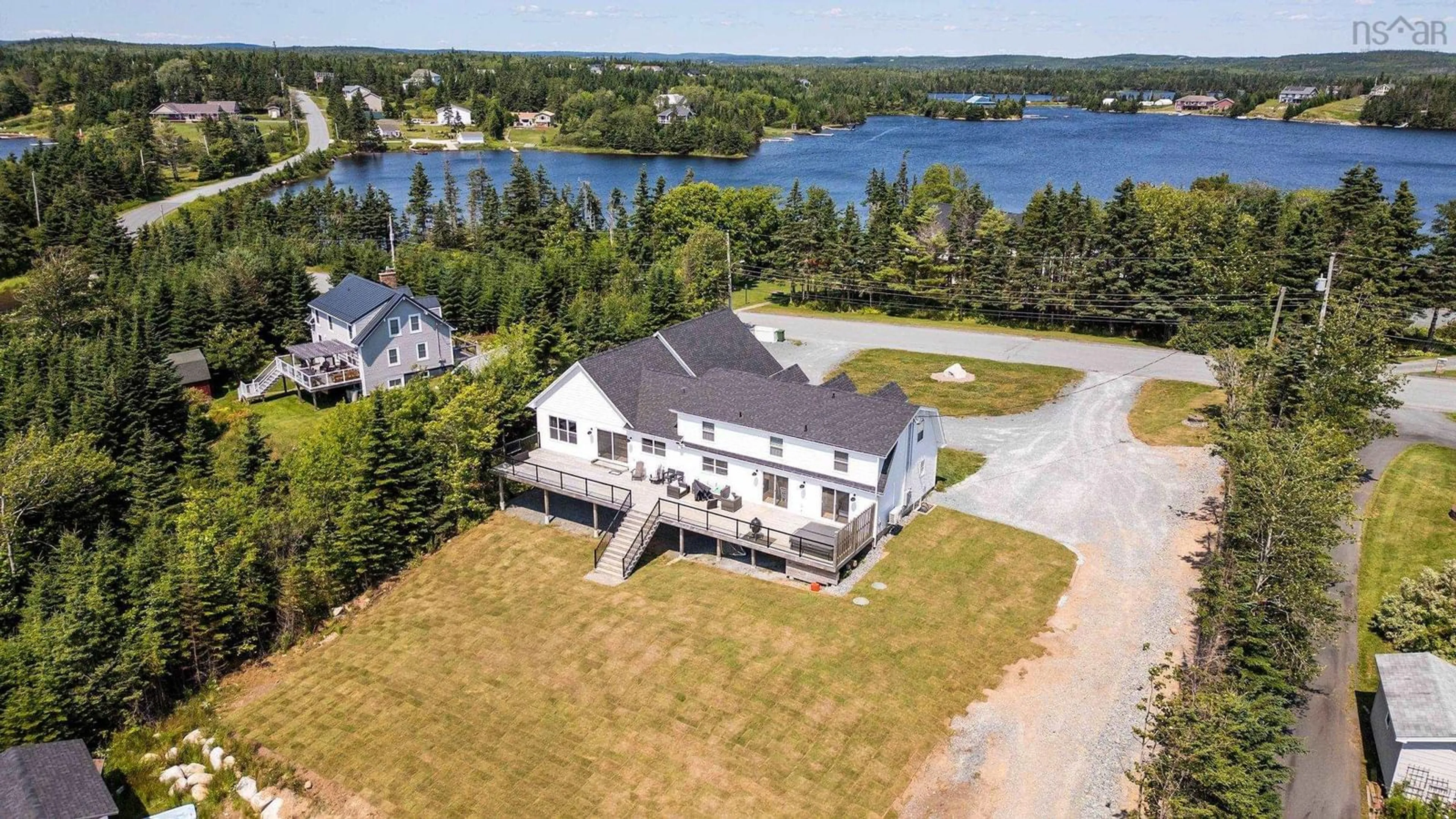 A pic from outside/outdoor area/front of a property/back of a property/a pic from drone, water/lake/river/ocean view for 103 Capri Drive, West Porters Lake Nova Scotia B3E 1L6