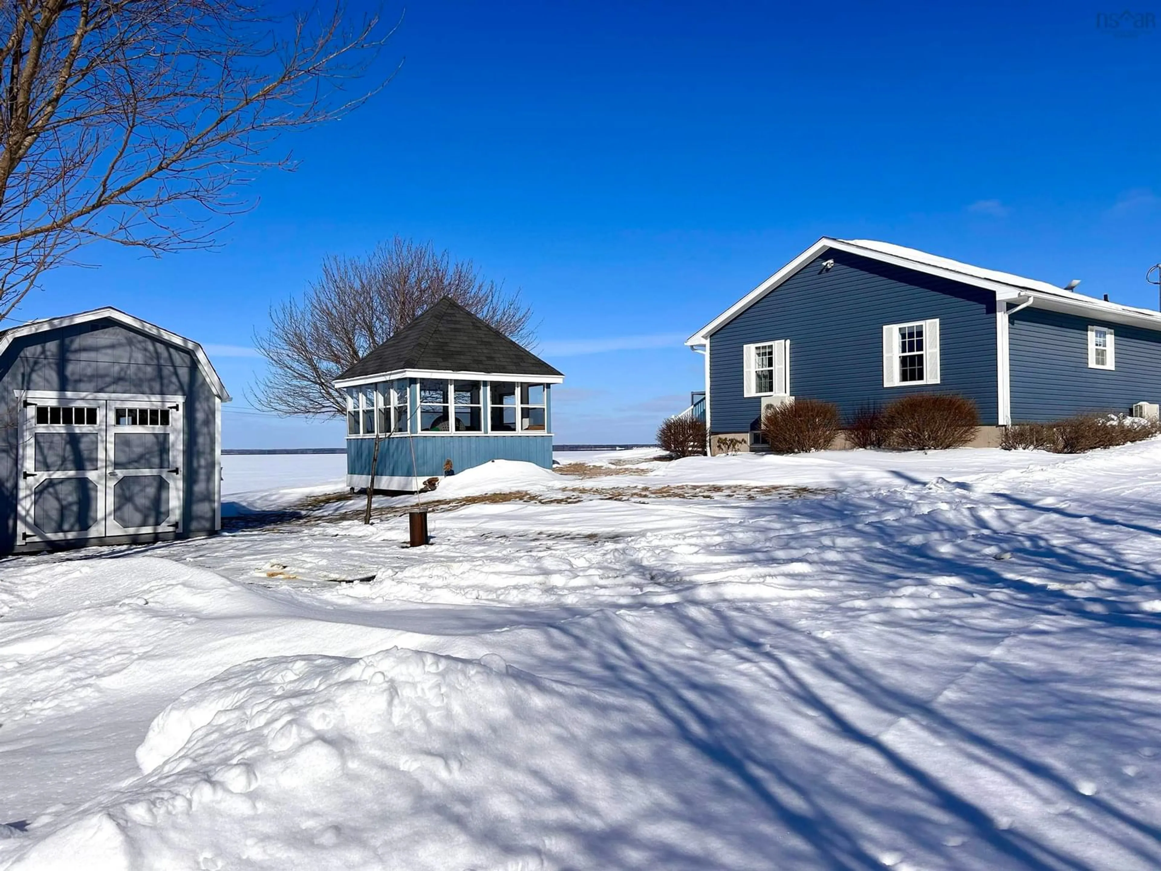 A pic from outside/outdoor area/front of a property/back of a property/a pic from drone, water/lake/river/ocean view for 11 Beach Rd, Tidnish Bridge Nova Scotia B4H 3X9