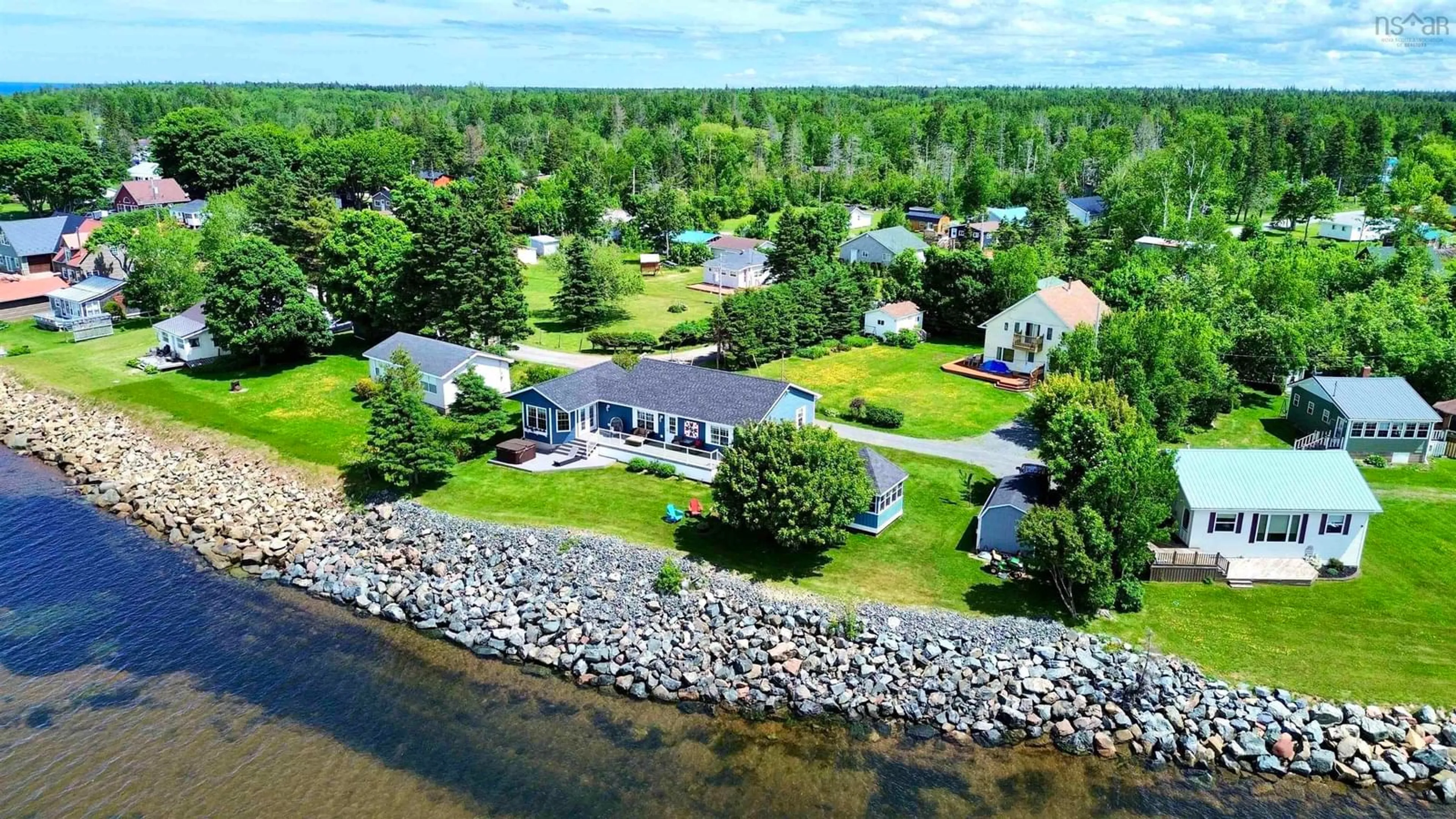 A pic from outside/outdoor area/front of a property/back of a property/a pic from drone, water/lake/river/ocean view for 11 Beach Rd, Tidnish Bridge Nova Scotia B4H 3X9