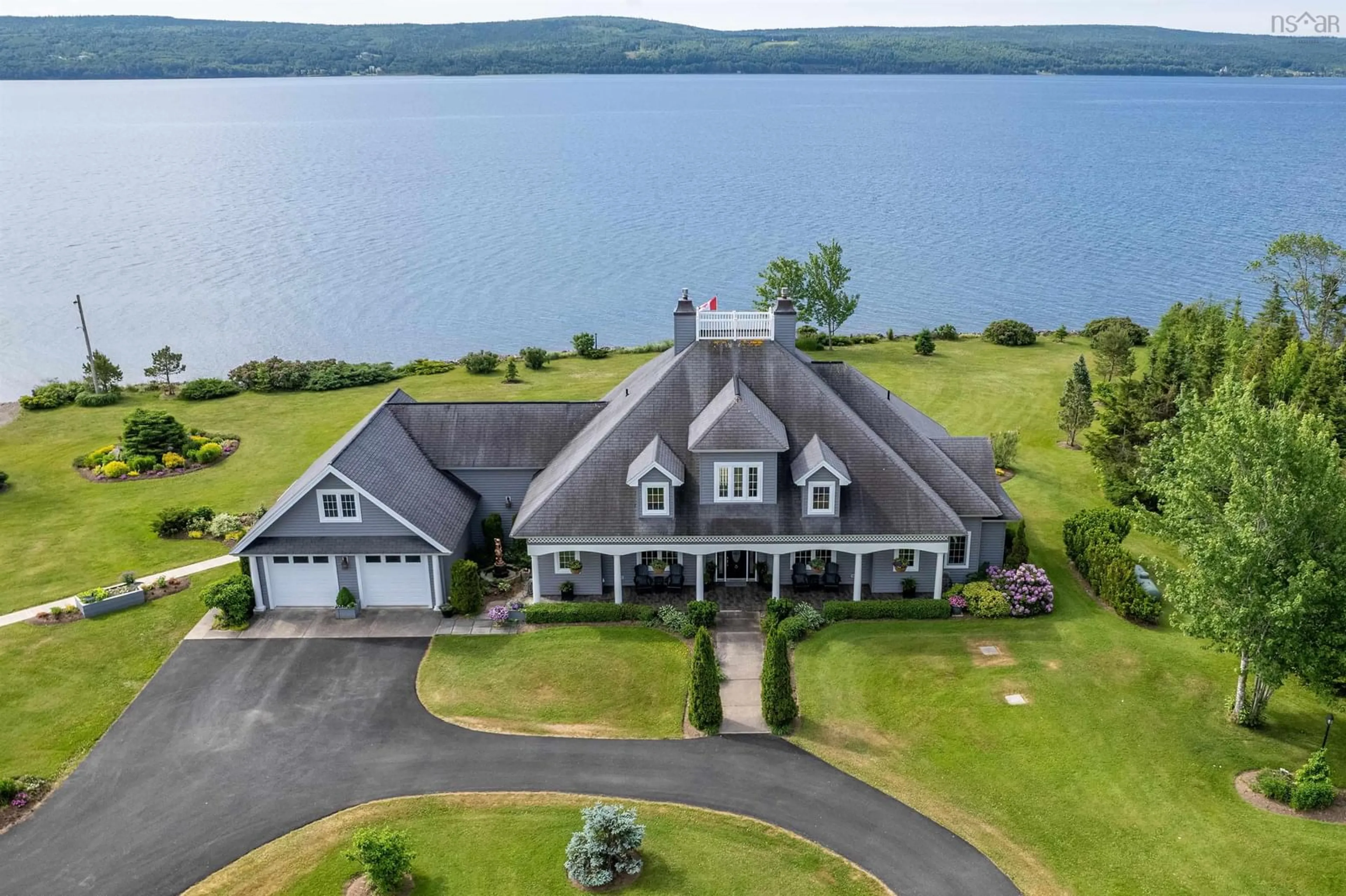 A pic from outside/outdoor area/front of a property/back of a property/a pic from drone, water/lake/river/ocean view for 8805 Highway 105 Baddeck Inlet Hwy, Baddeck Inlet Nova Scotia B0E 1B0