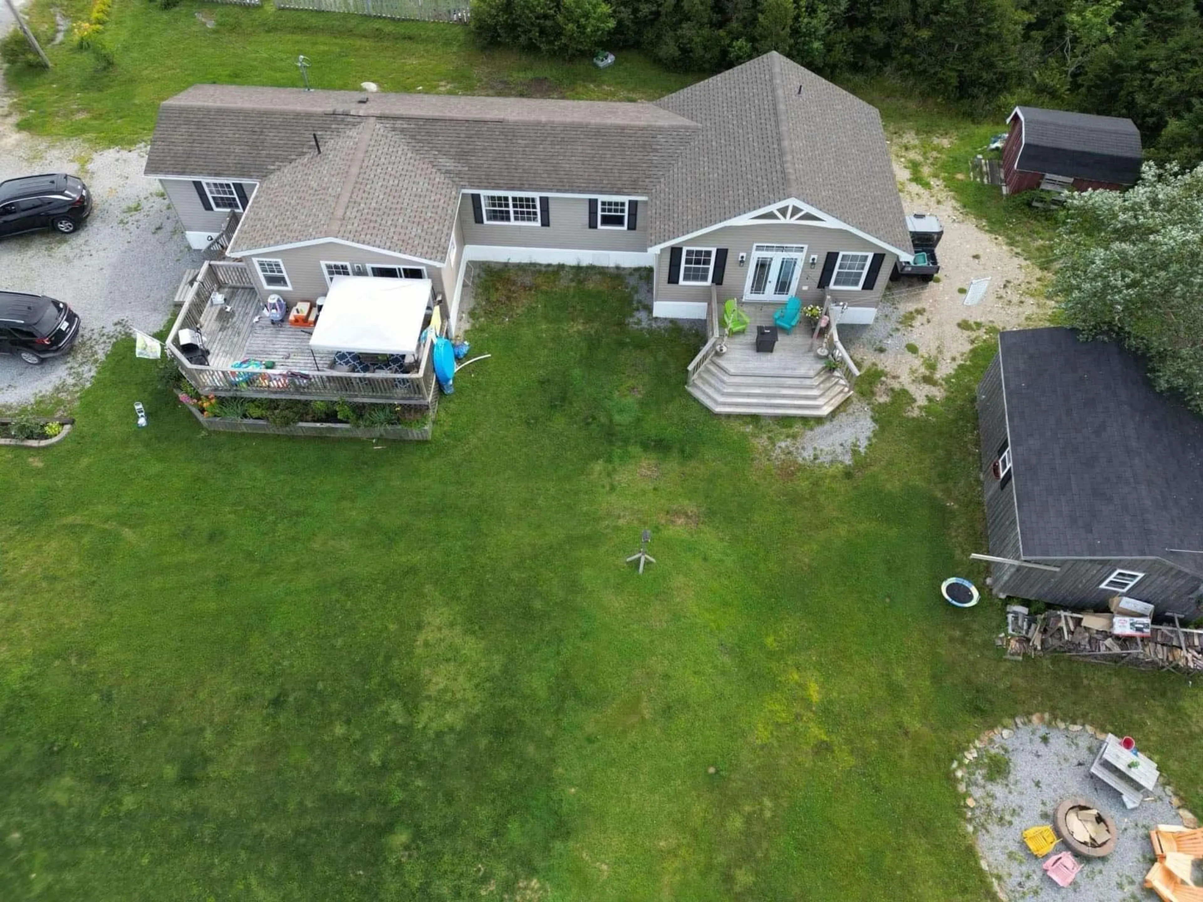 A pic from outside/outdoor area/front of a property/back of a property/a pic from drone, water/lake/river/ocean view for 13 Cabin Rd, North East Point Nova Scotia B0W 2P0