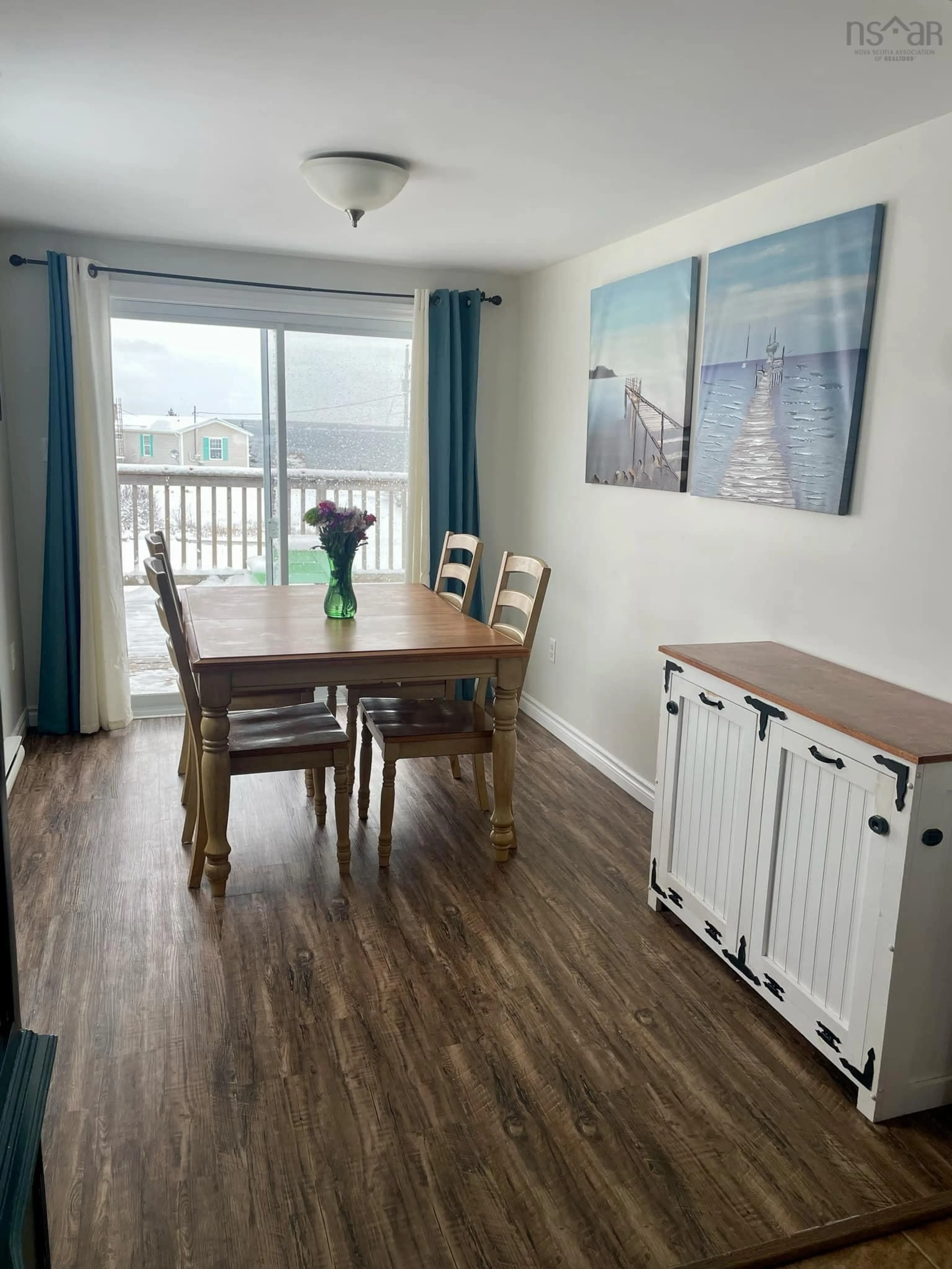 Dining room, wood/laminate floor for 13 Cabin Rd, North East Point Nova Scotia B0W 2P0