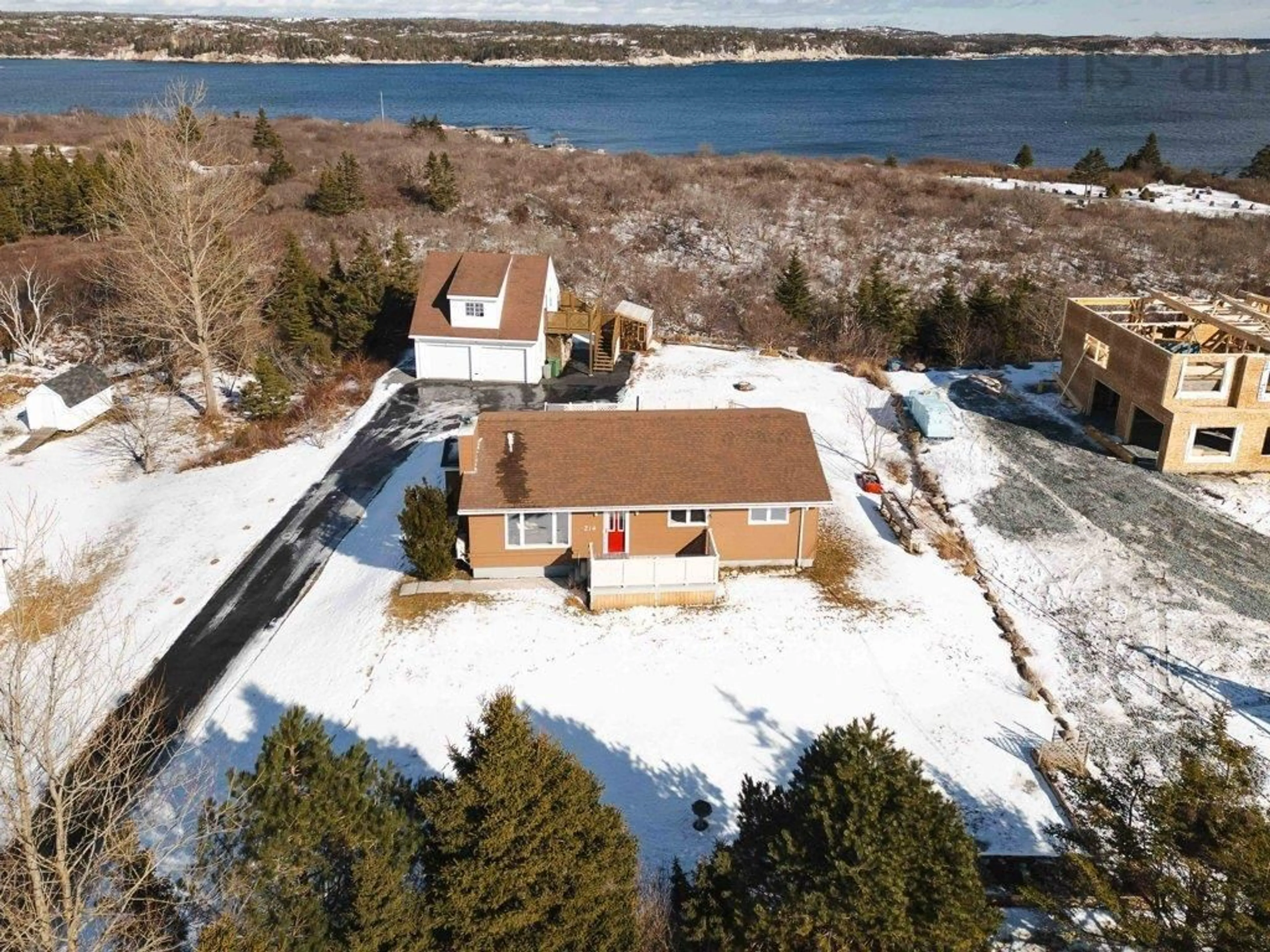 A pic from outside/outdoor area/front of a property/back of a property/a pic from drone, water/lake/river/ocean view for 214 Sandy Cove Rd, Terence Bay Nova Scotia B3T 1Y5