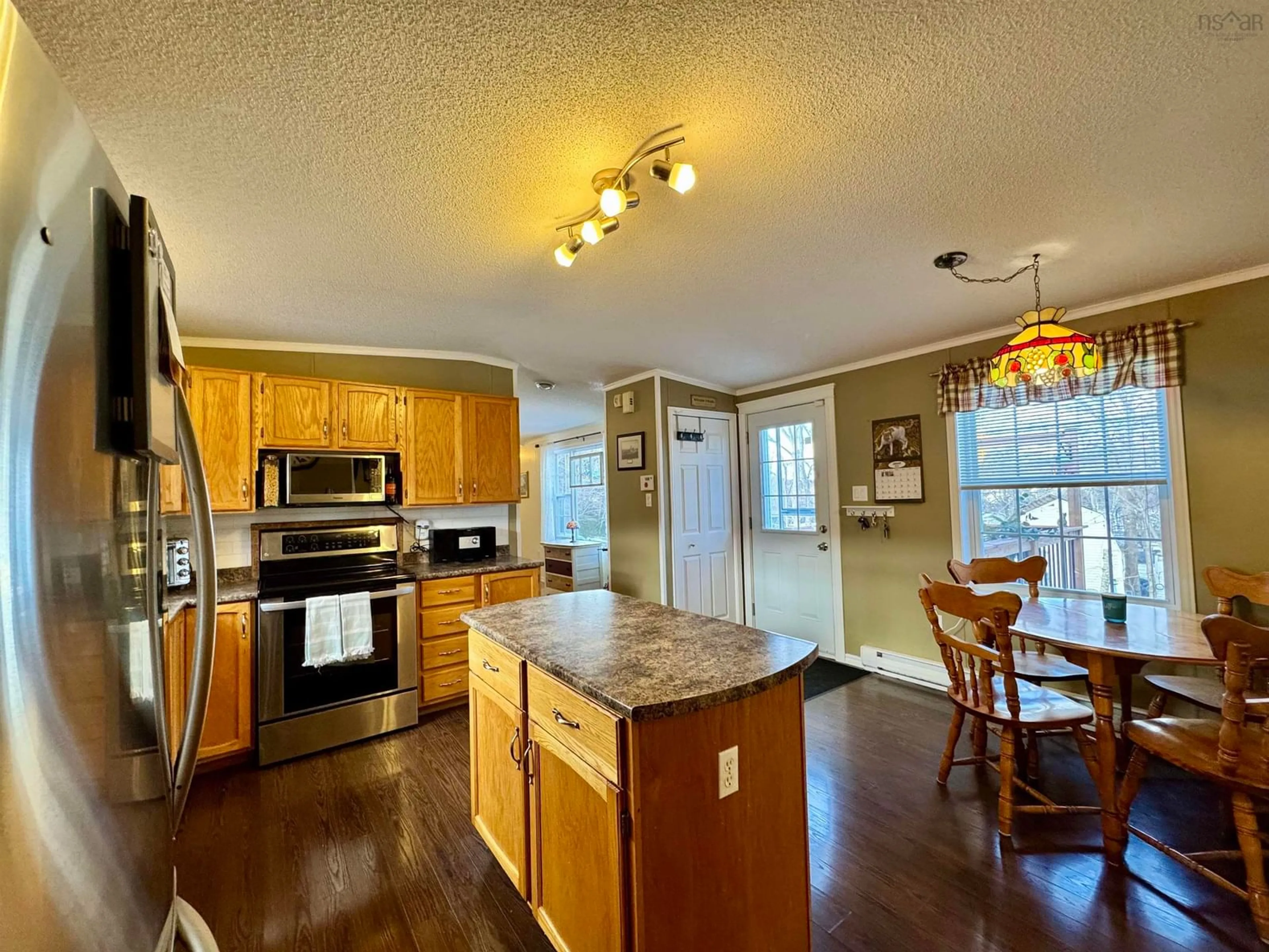 Open concept kitchen, wood/laminate floor for 428 Glen Rise Dr, Beaver Bank Nova Scotia B4E 1M3