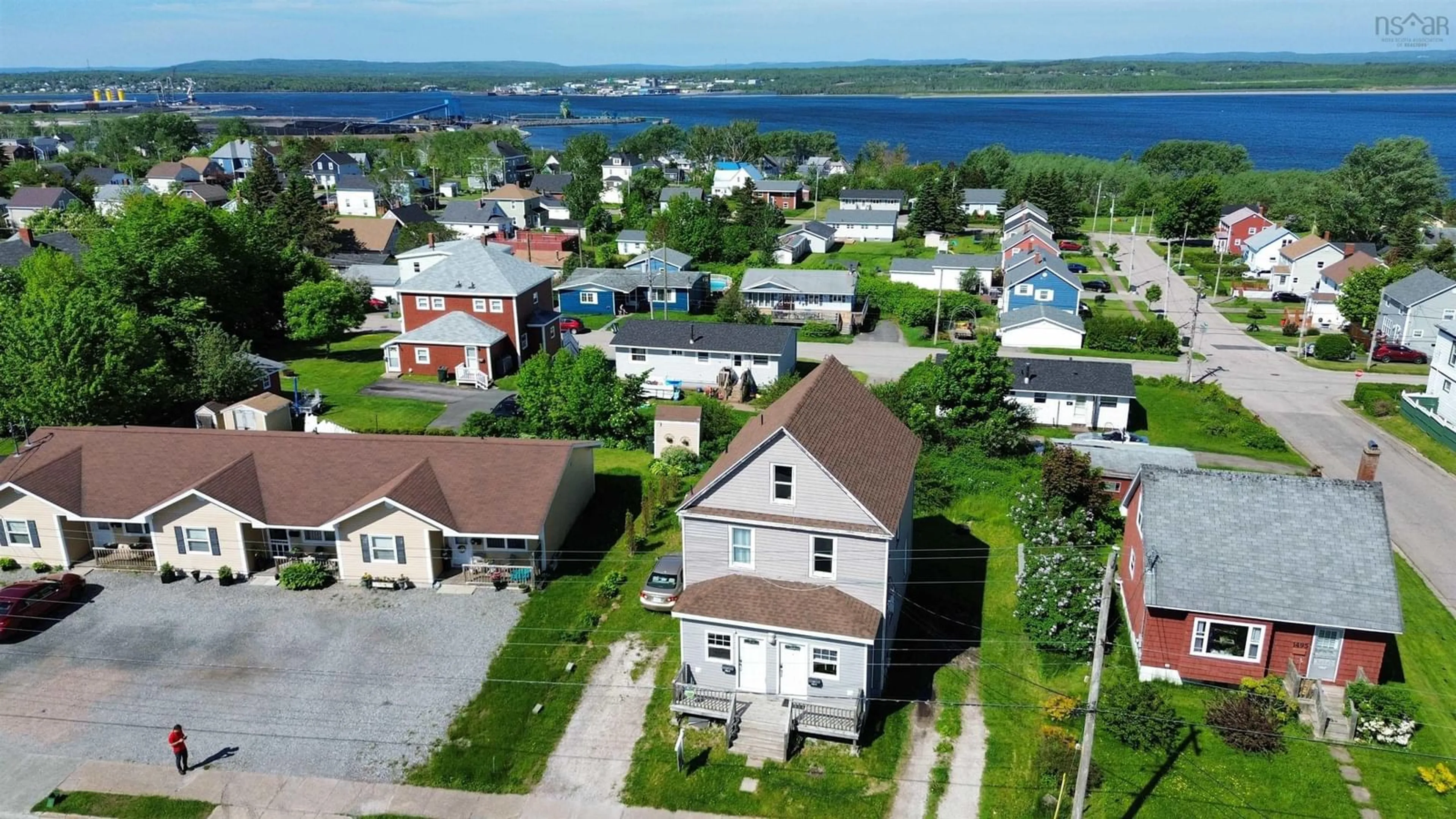 A pic from outside/outdoor area/front of a property/back of a property/a pic from drone, street for 1491 Victoria Rd, Sydney Nova Scotia B1N 1M9