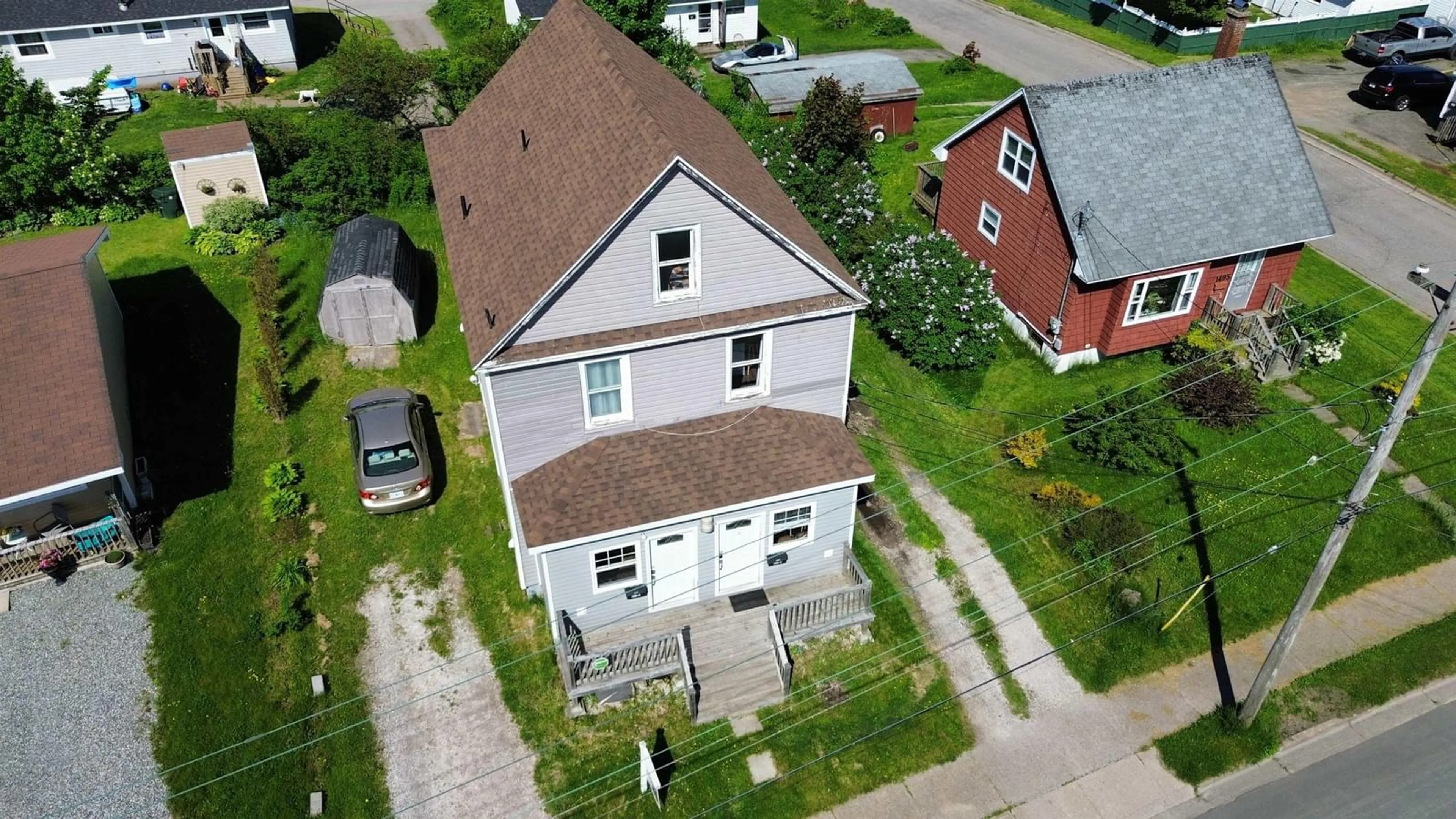 A pic from outside/outdoor area/front of a property/back of a property/a pic from drone, street for 1491 Victoria Rd, Sydney Nova Scotia B1N 1M9