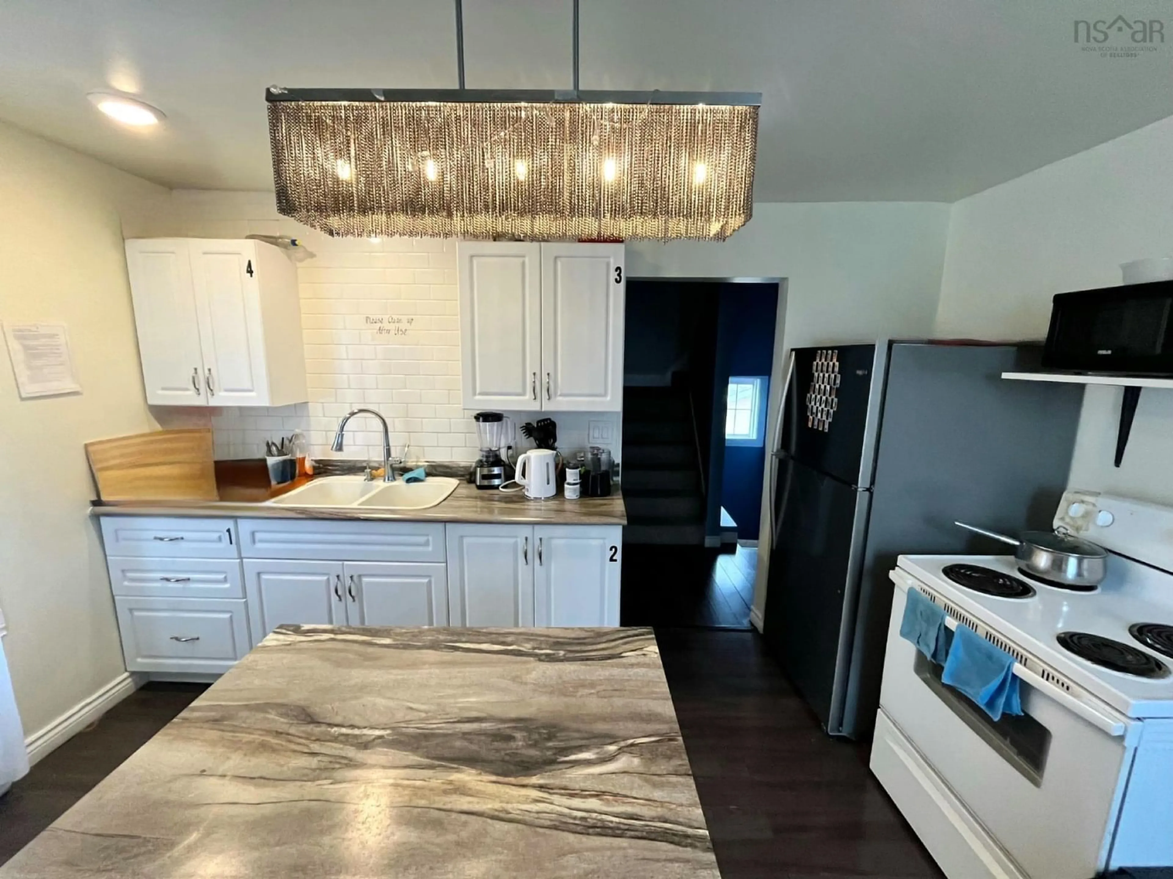 Open concept kitchen, unknown for 1491 Victoria Rd, Sydney Nova Scotia B1N 1M9