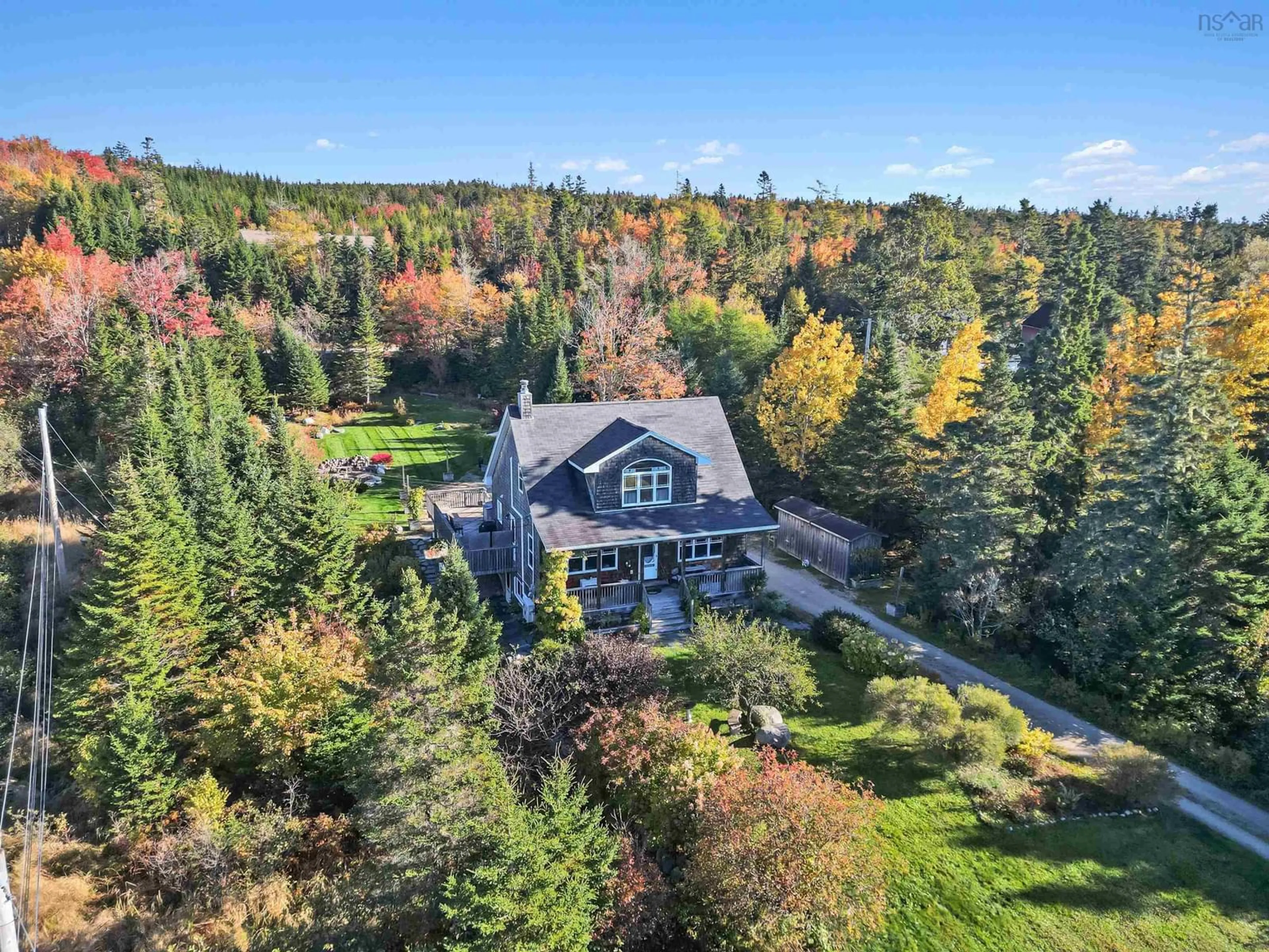 A pic from outside/outdoor area/front of a property/back of a property/a pic from drone, forest/trees view for 8493 St Margarets Bay Rd, Black Point Nova Scotia B0J 1B0