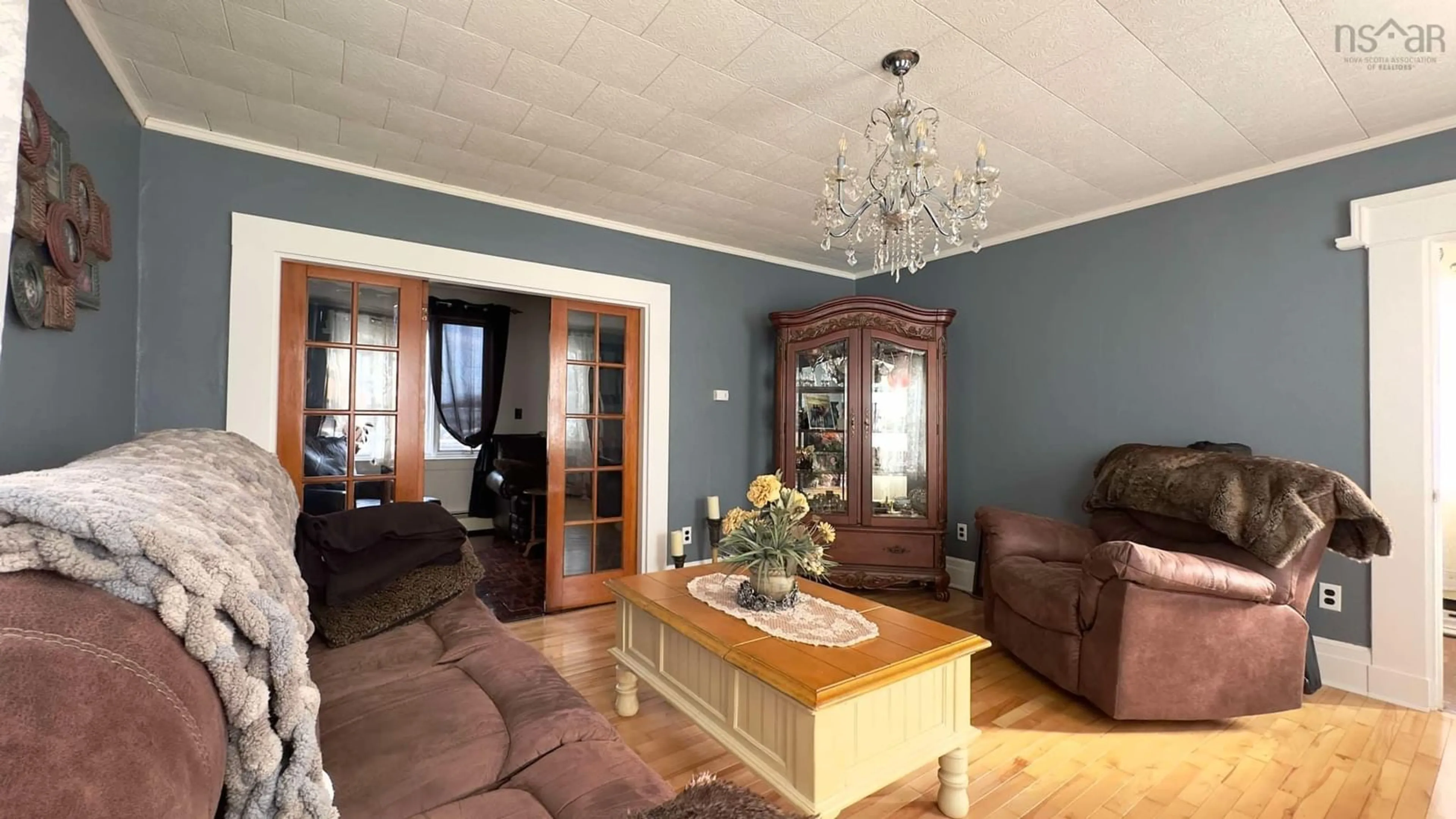 Living room with furniture, wood/laminate floor for 3195 Highway 3, Barrington Passage Nova Scotia B0W 1G0