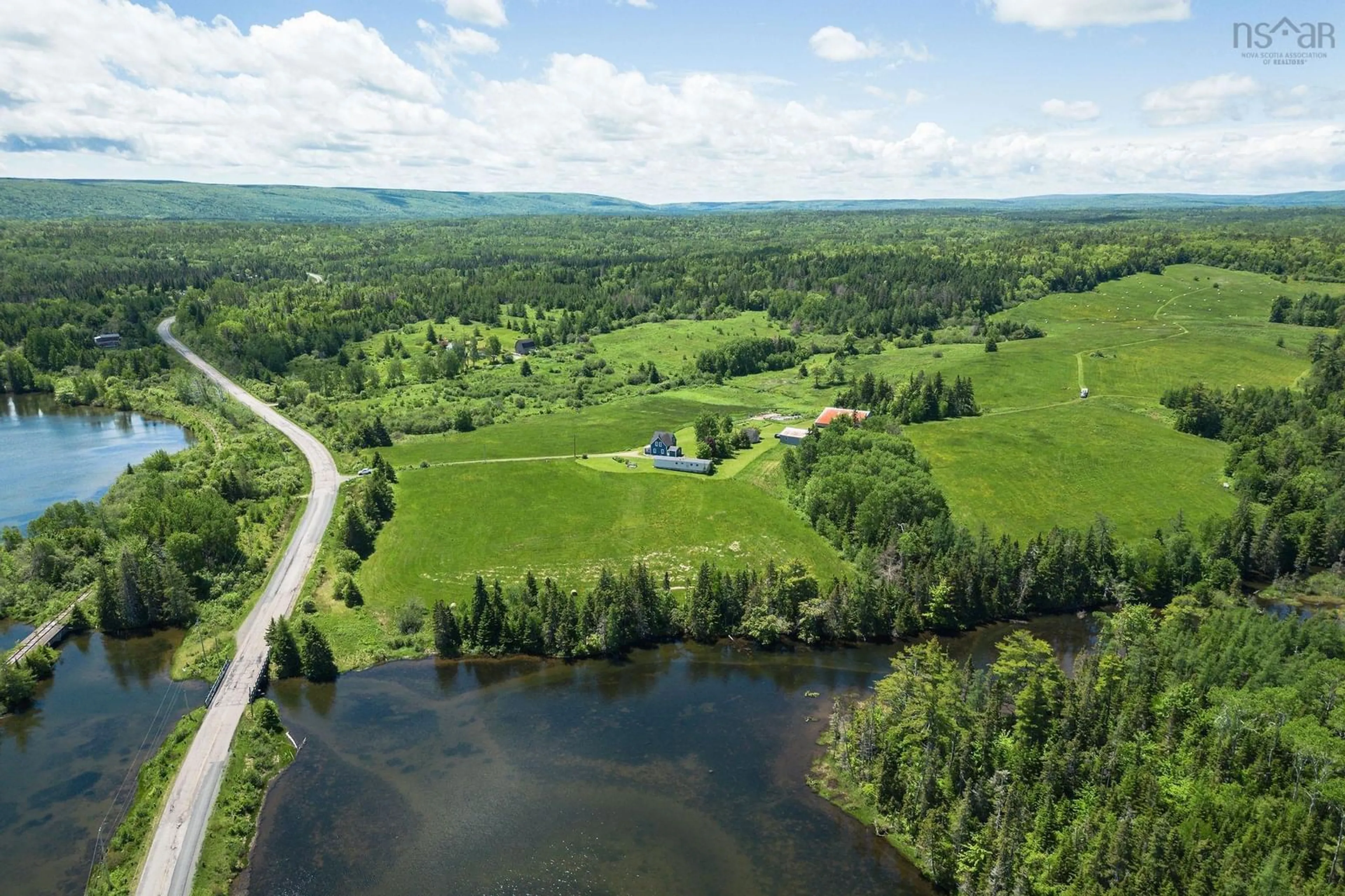 A pic from outside/outdoor area/front of a property/back of a property/a pic from drone, water/lake/river/ocean view for 10353 Marble Mountain Rd, Orangedale Nova Scotia B0E 2K0