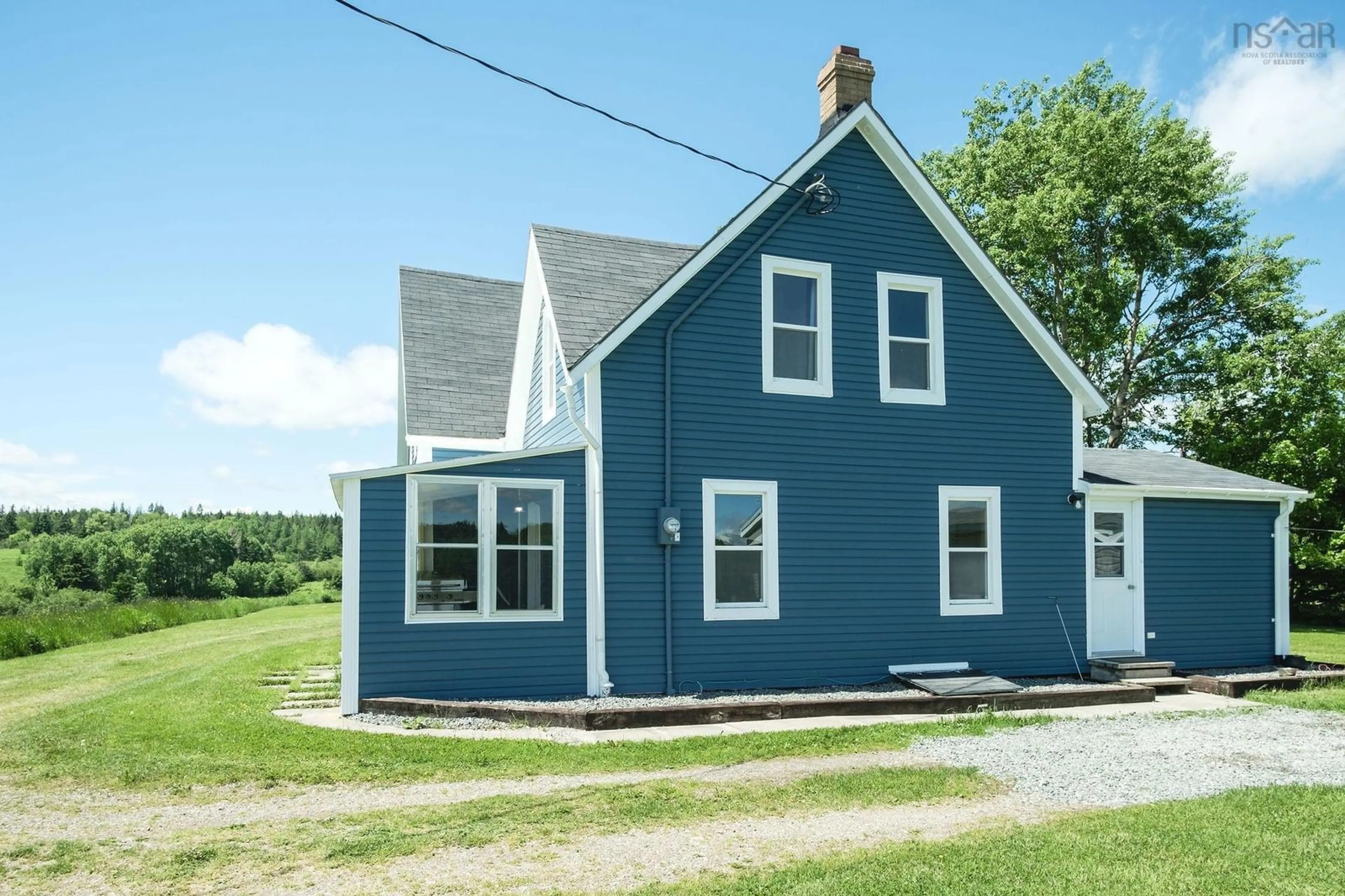 Home with vinyl exterior material, street for 10353 Marble Mountain Rd, Orangedale Nova Scotia B0E 2K0