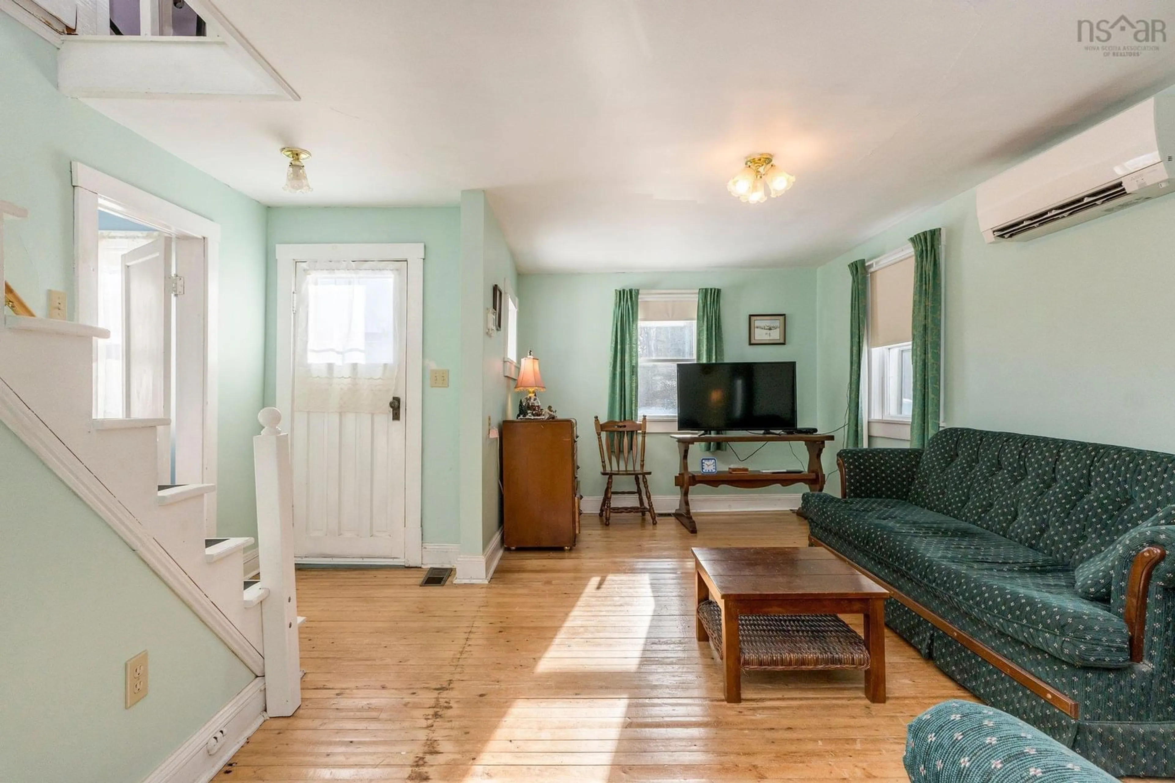 Living room with furniture, wood/laminate floor for 8431 Highway 215, Cambridge Nova Scotia B0N 2R0