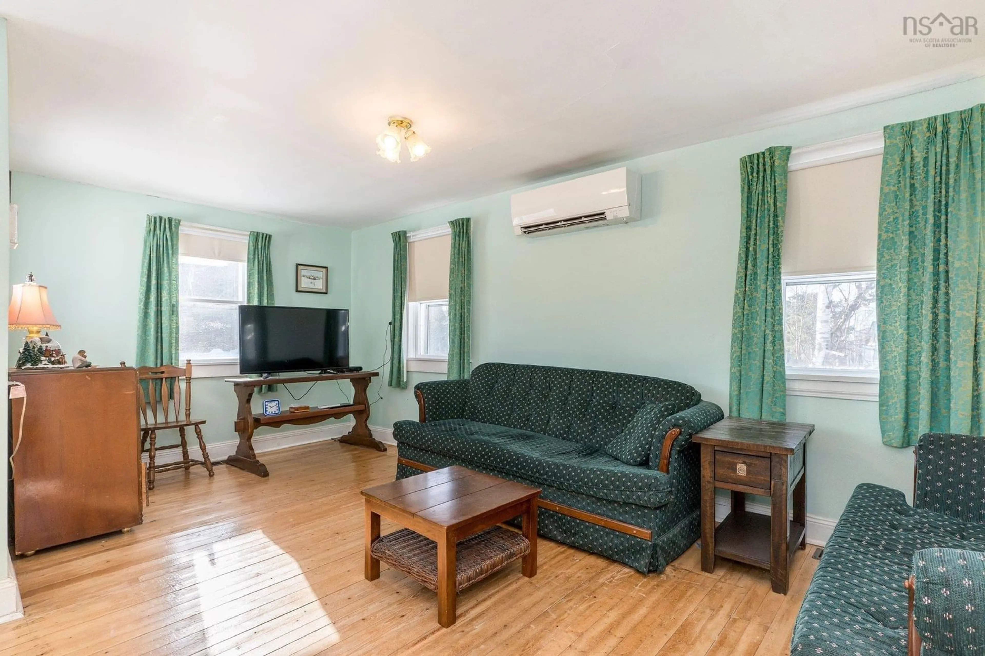 Living room with furniture, wood/laminate floor for 8431 Highway 215, Cambridge Nova Scotia B0N 2R0