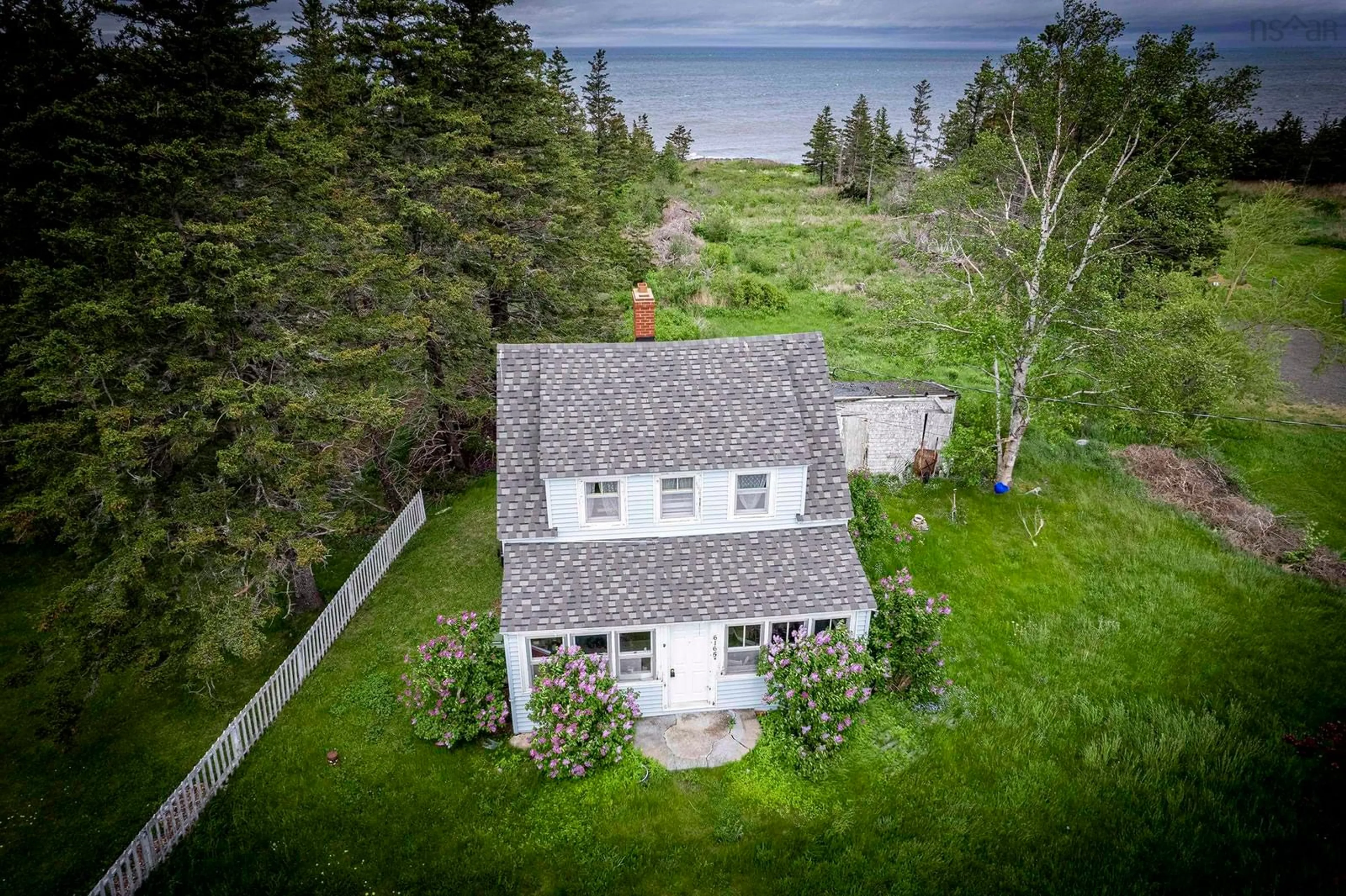 A pic from outside/outdoor area/front of a property/back of a property/a pic from drone, water/lake/river/ocean view for 6165 Shore Rd, Youngs Cove Nova Scotia B0S 1A0