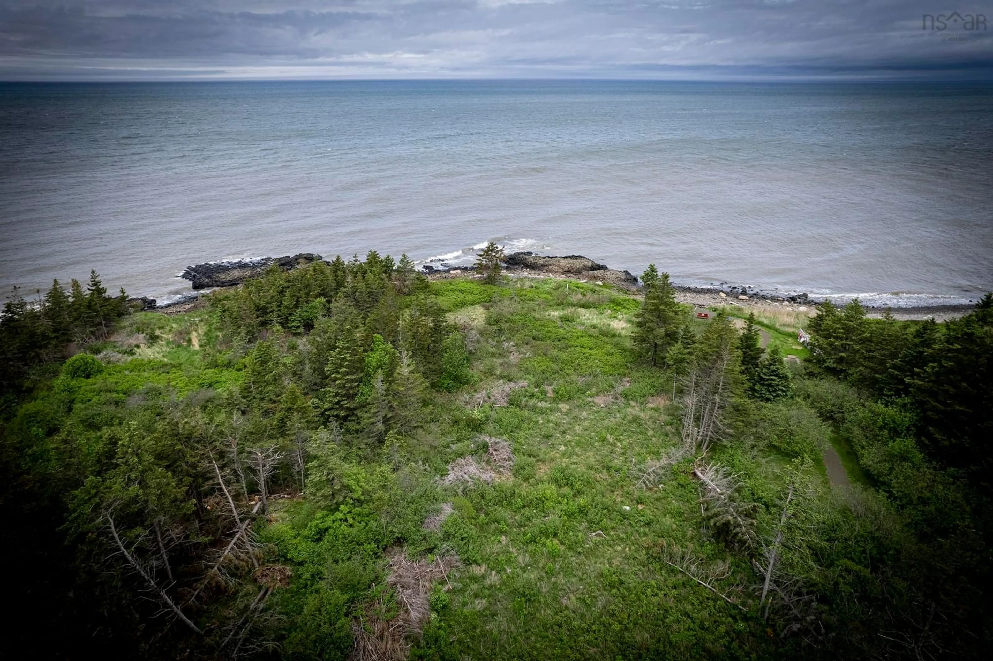 A pic from outside/outdoor area/front of a property/back of a property/a pic from drone, water/lake/river/ocean view for 6165 Shore Rd, Youngs Cove Nova Scotia B0S 1A0