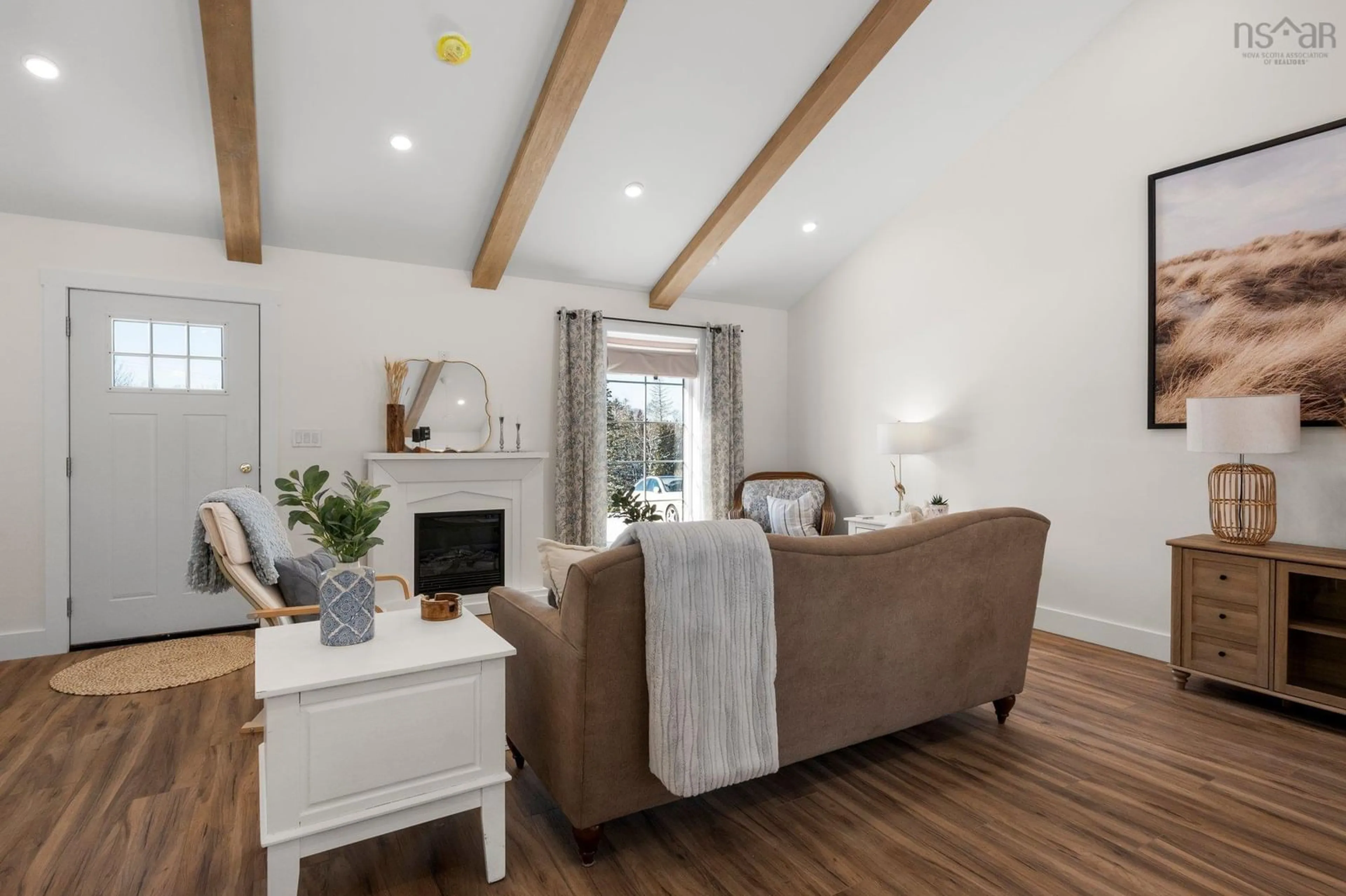 Living room with furniture, wood/laminate floor for 823 Blue Rocks Rd, Garden Lots Nova Scotia B0J 2C0