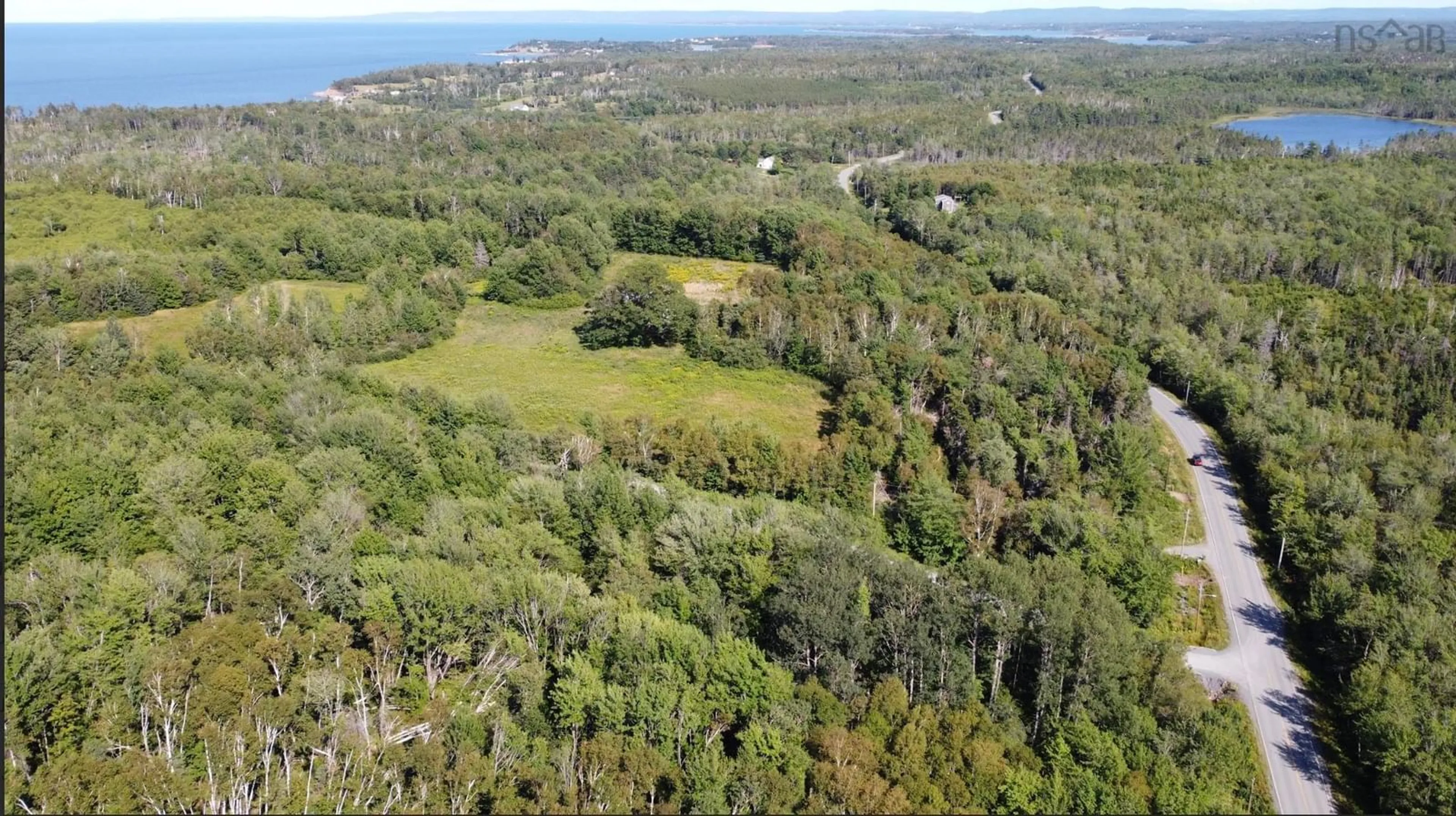 A pic from outside/outdoor area/front of a property/back of a property/a pic from drone, forest/trees view for 7035 Pictou Landing Rd, Chance Harbour Nova Scotia B0K 1X0