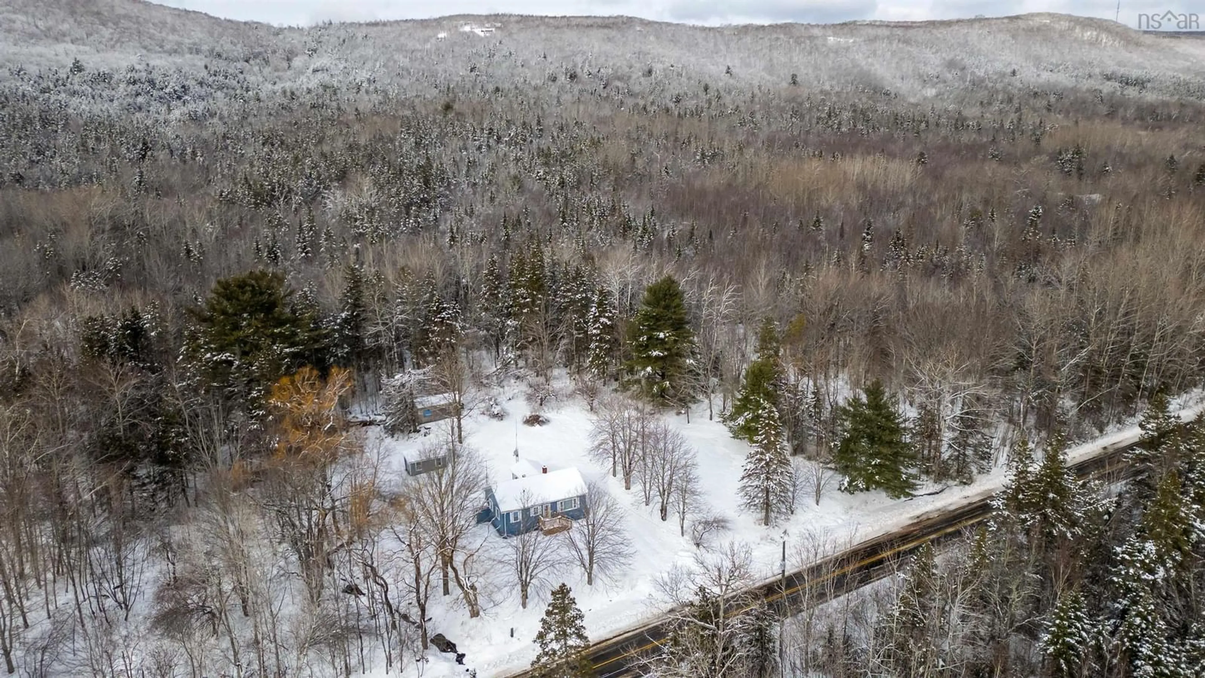 A pic from outside/outdoor area/front of a property/back of a property/a pic from drone, forest/trees view for 627 Clarence Rd, Beaconsfield Nova Scotia B0S 1M0