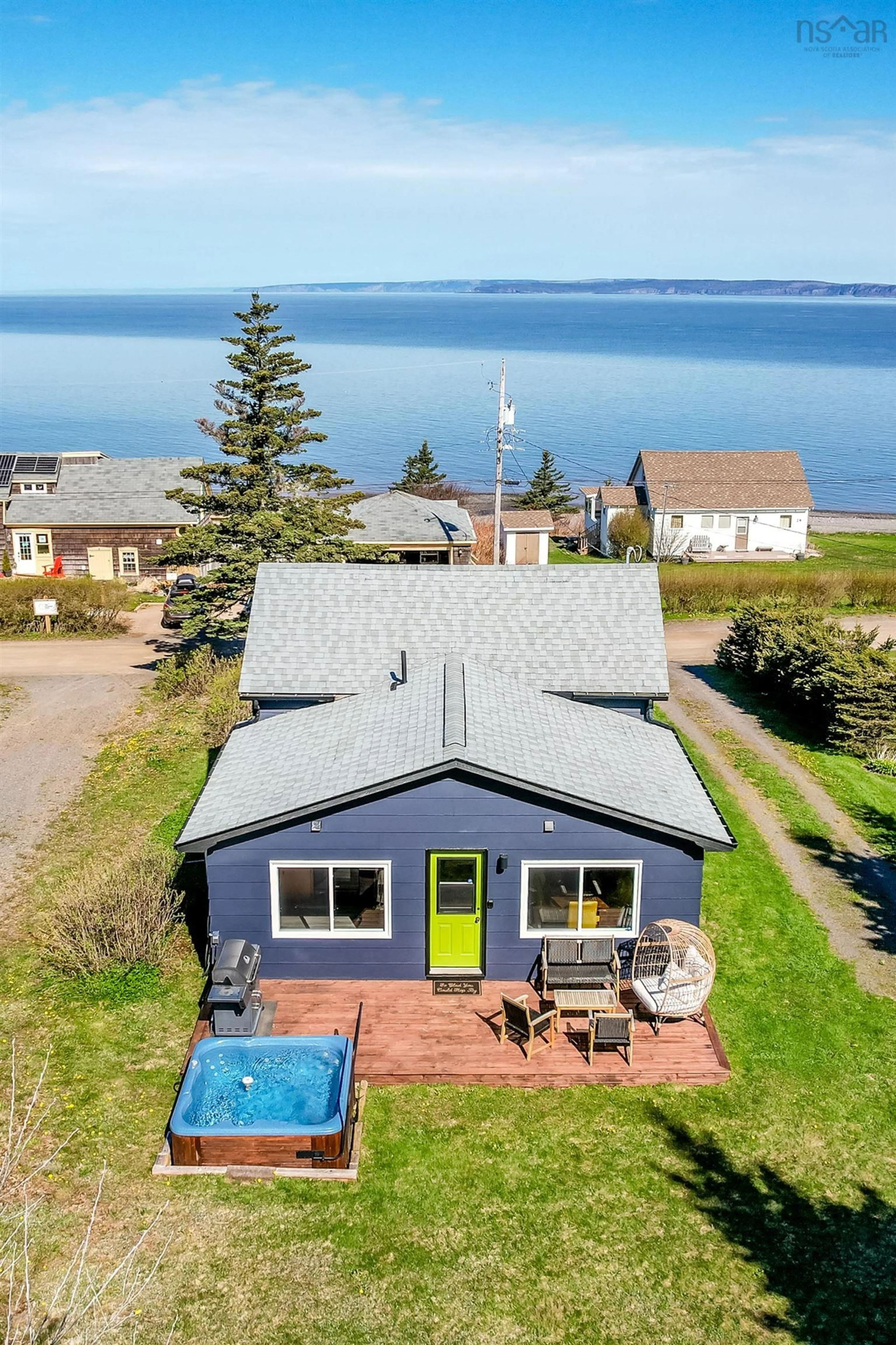 A pic from outside/outdoor area/front of a property/back of a property/a pic from drone, water/lake/river/ocean view for 20 Cove Rd, Halls Harbour Nova Scotia B0P 1J0