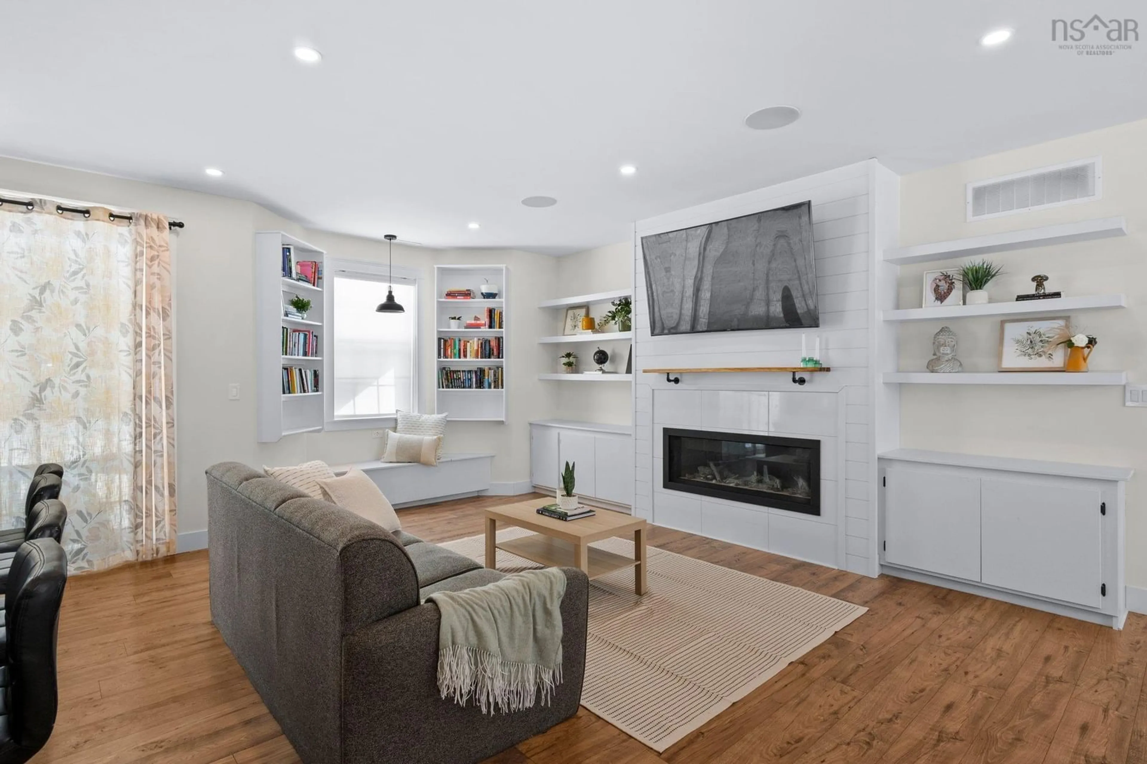 Living room with furniture, wood/laminate floor for 122 Murphy's Rd, Wyses Corner Nova Scotia B0N 1Y0