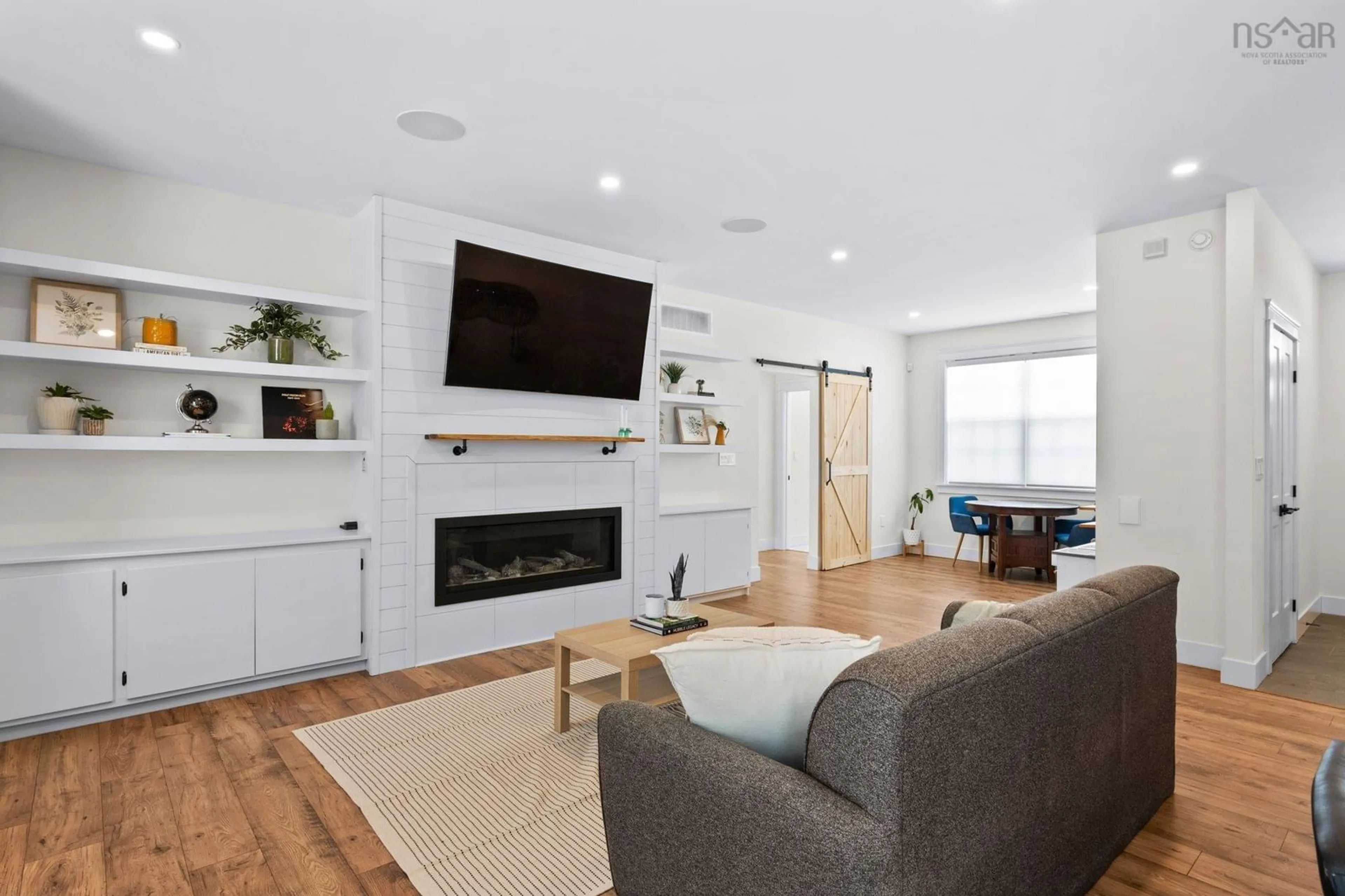 Living room with furniture, wood/laminate floor for 122 Murphy's Rd, Wyses Corner Nova Scotia B0N 1Y0