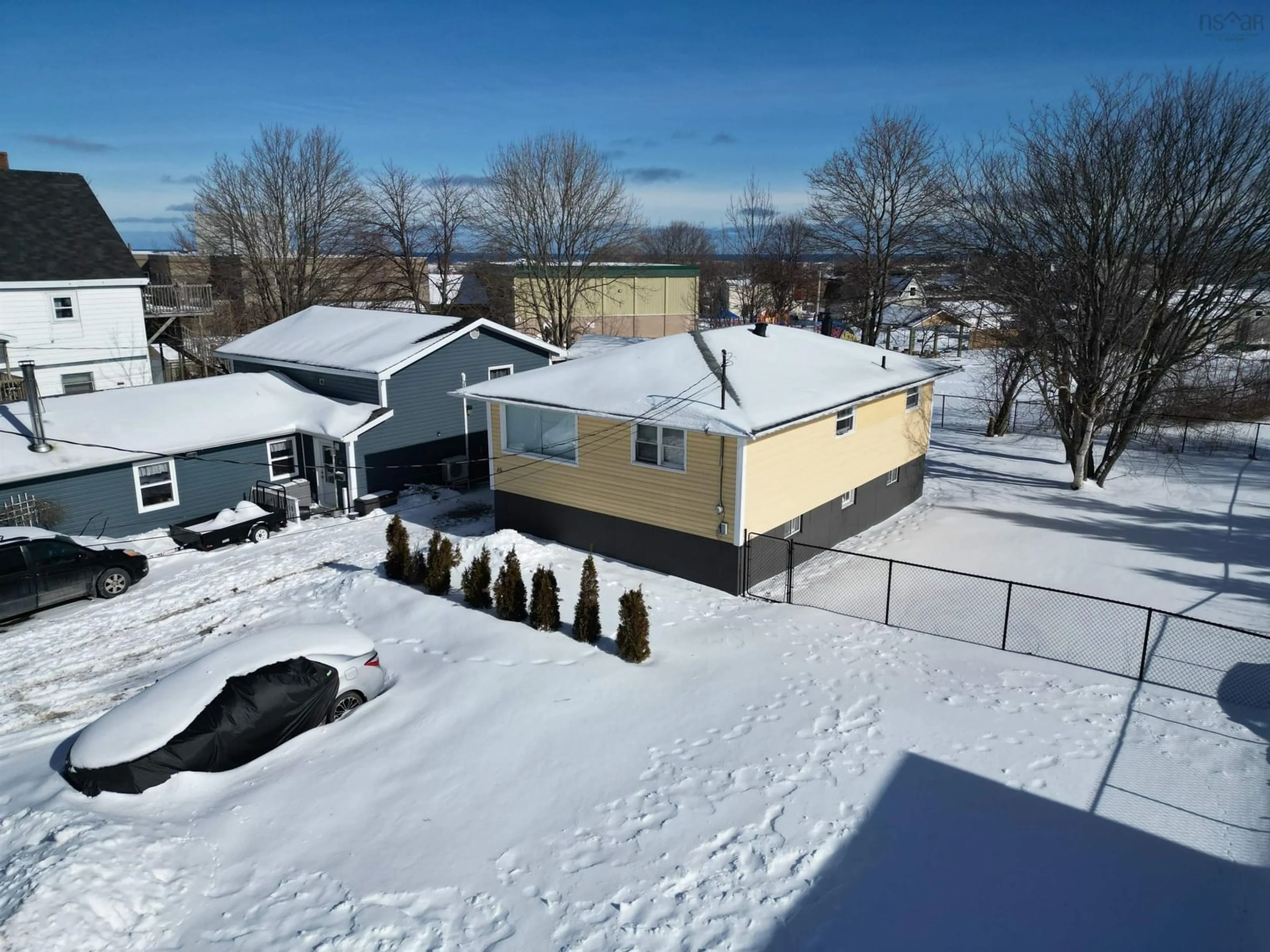 A pic from outside/outdoor area/front of a property/back of a property/a pic from drone, unknown for 15 Clyde Avenue, Sydney Mines Nova Scotia B1V 2E3