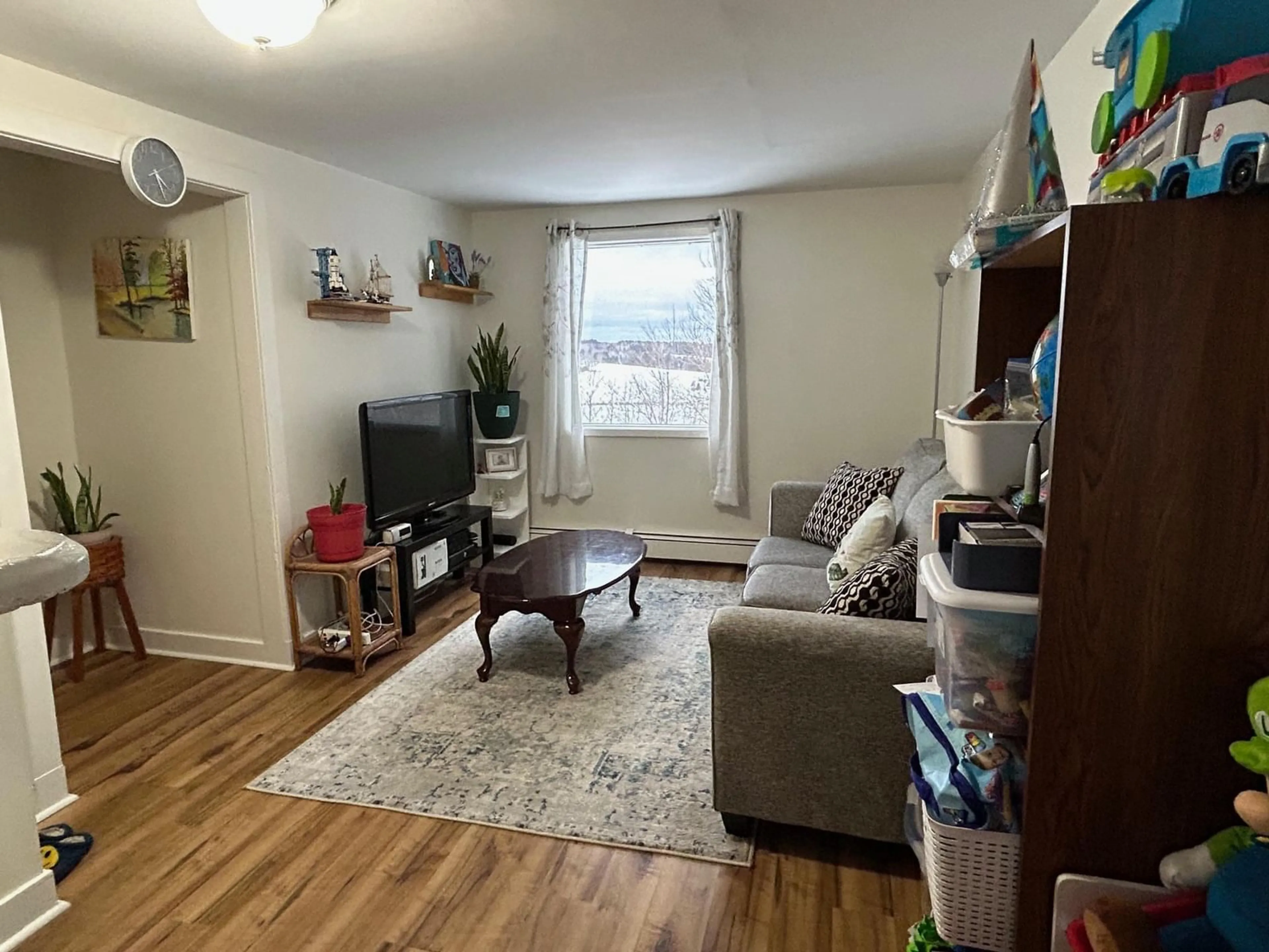 Living room with furniture, wood/laminate floor for 205 Lawrence St, Lunenburg Nova Scotia B0J 1C0