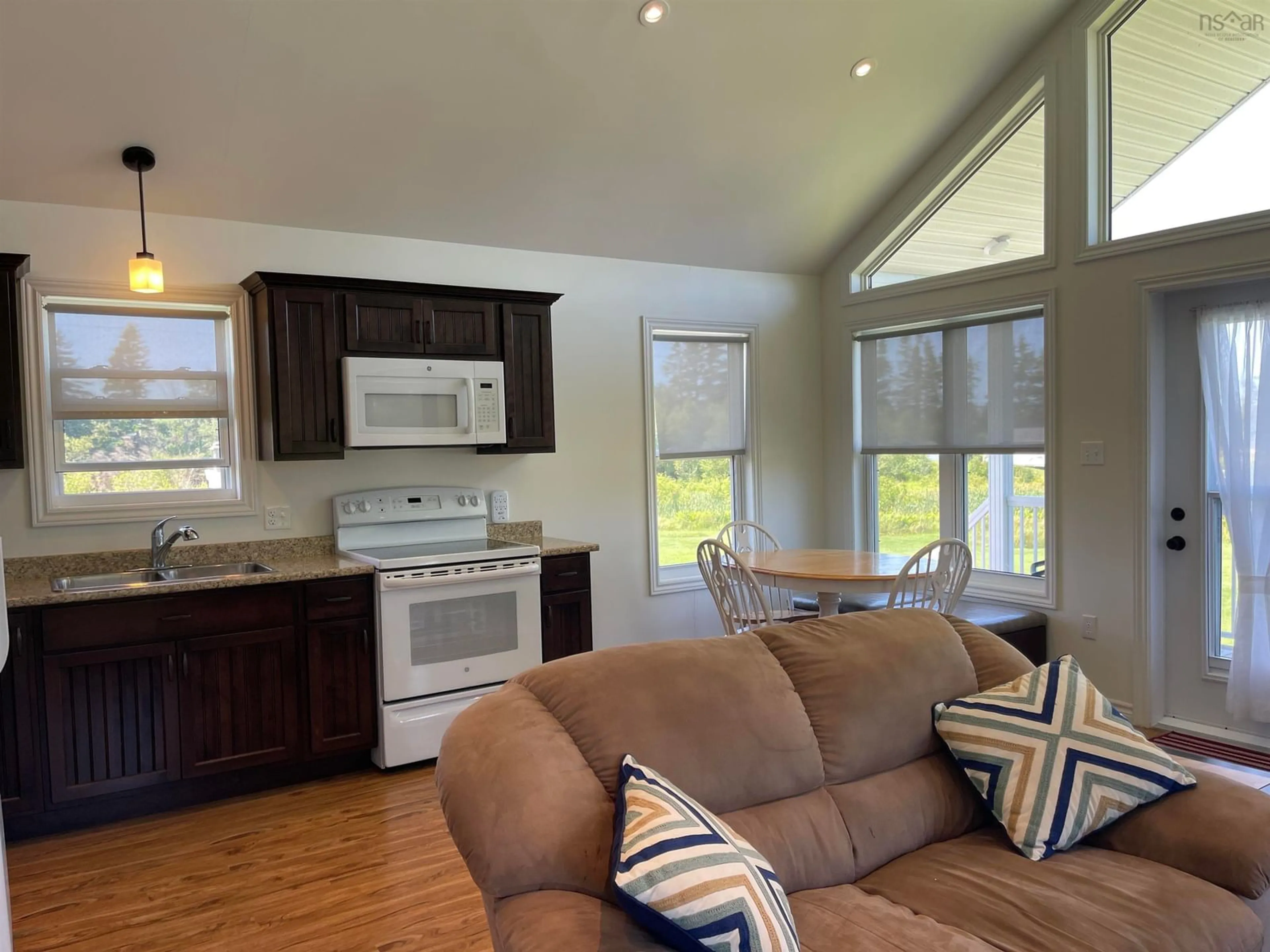 Open concept kitchen, wood/laminate floor for 39 Heron Dr, Caribou River Nova Scotia B0K 1H0