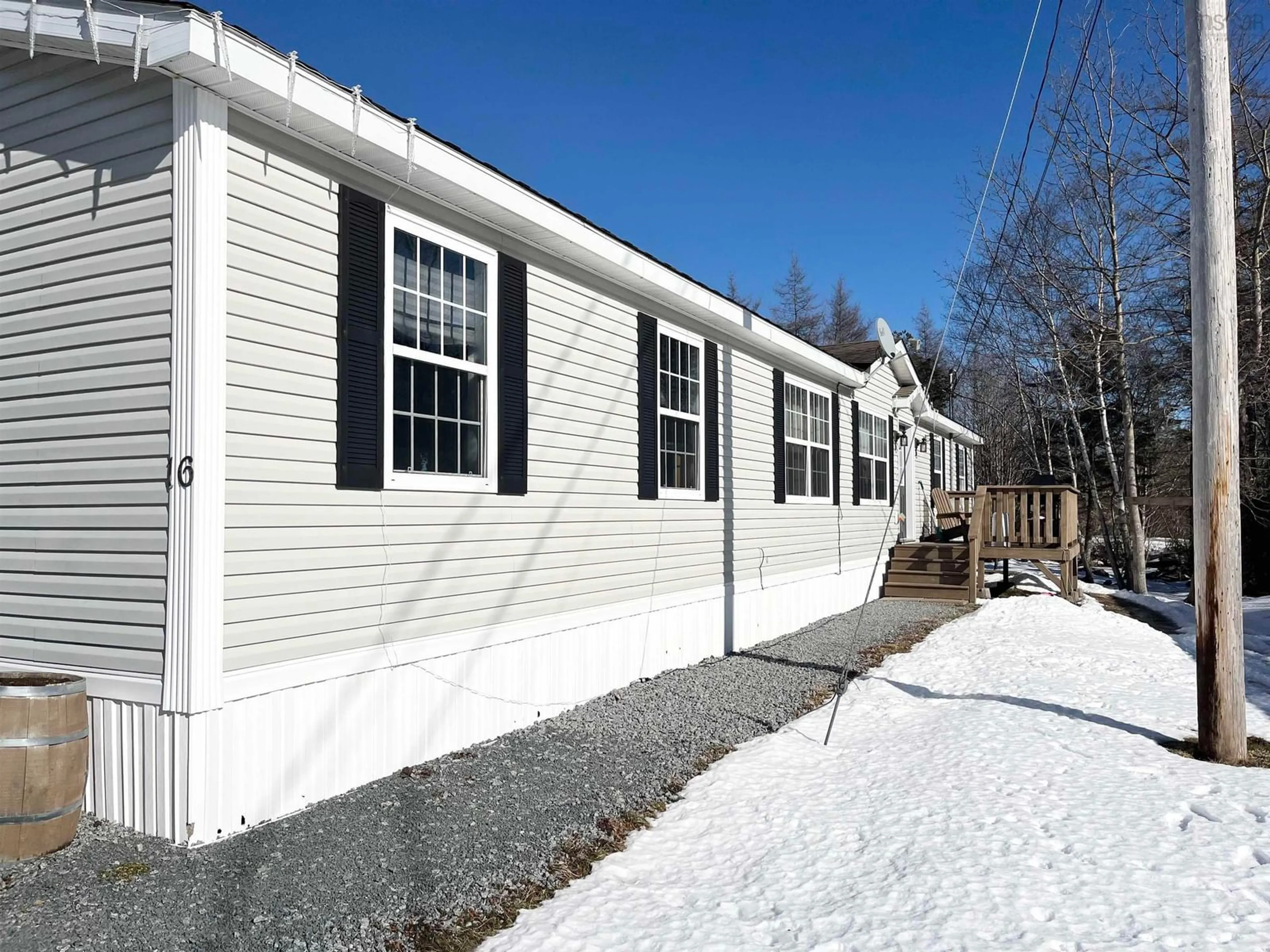 Home with vinyl exterior material, street for 16 Forest View Dr, Barrington Nova Scotia B0W 1E0