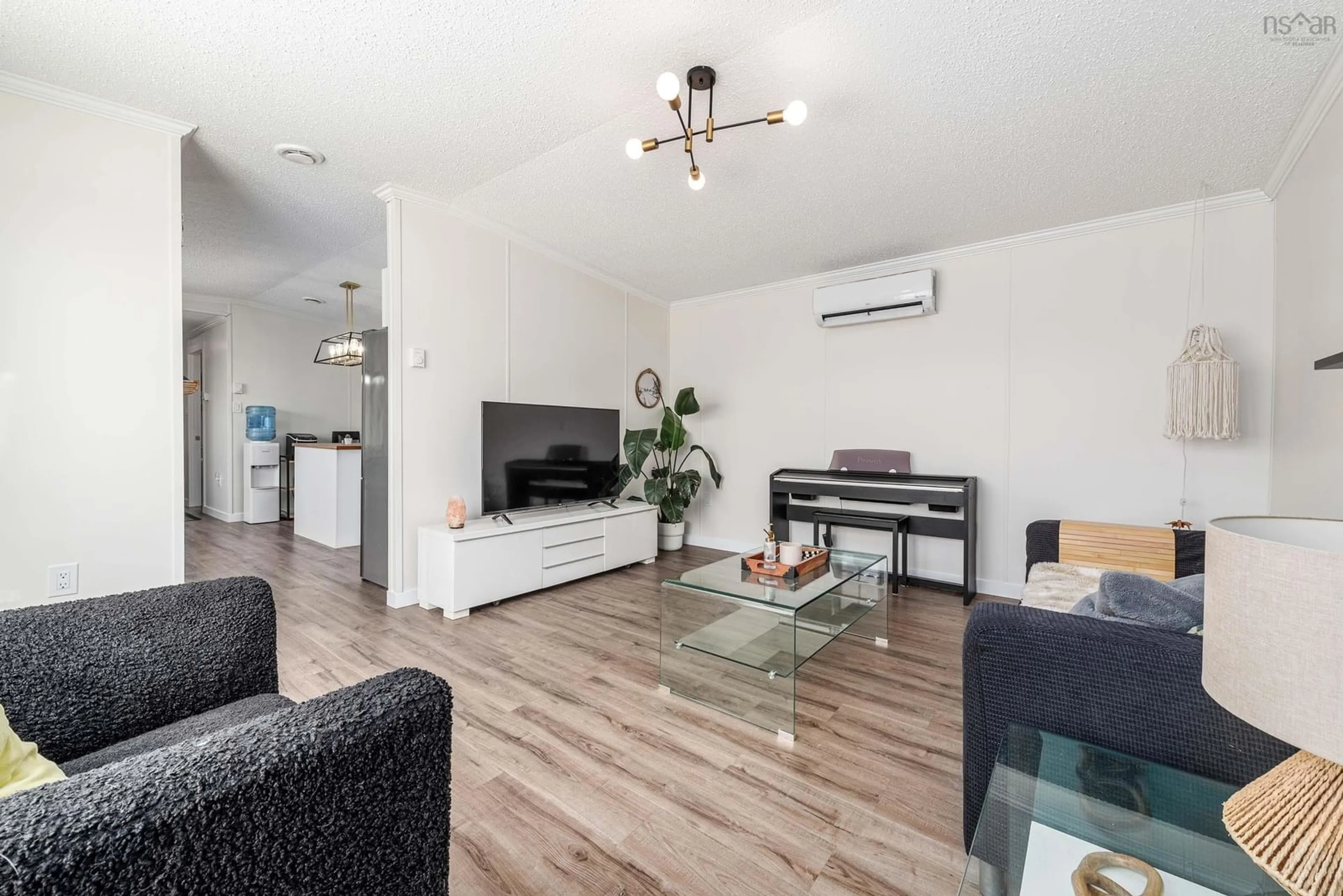 Living room with furniture, wood/laminate floor for 21 Christopher Ave, Mount Uniacke Nova Scotia B0N 1Z0