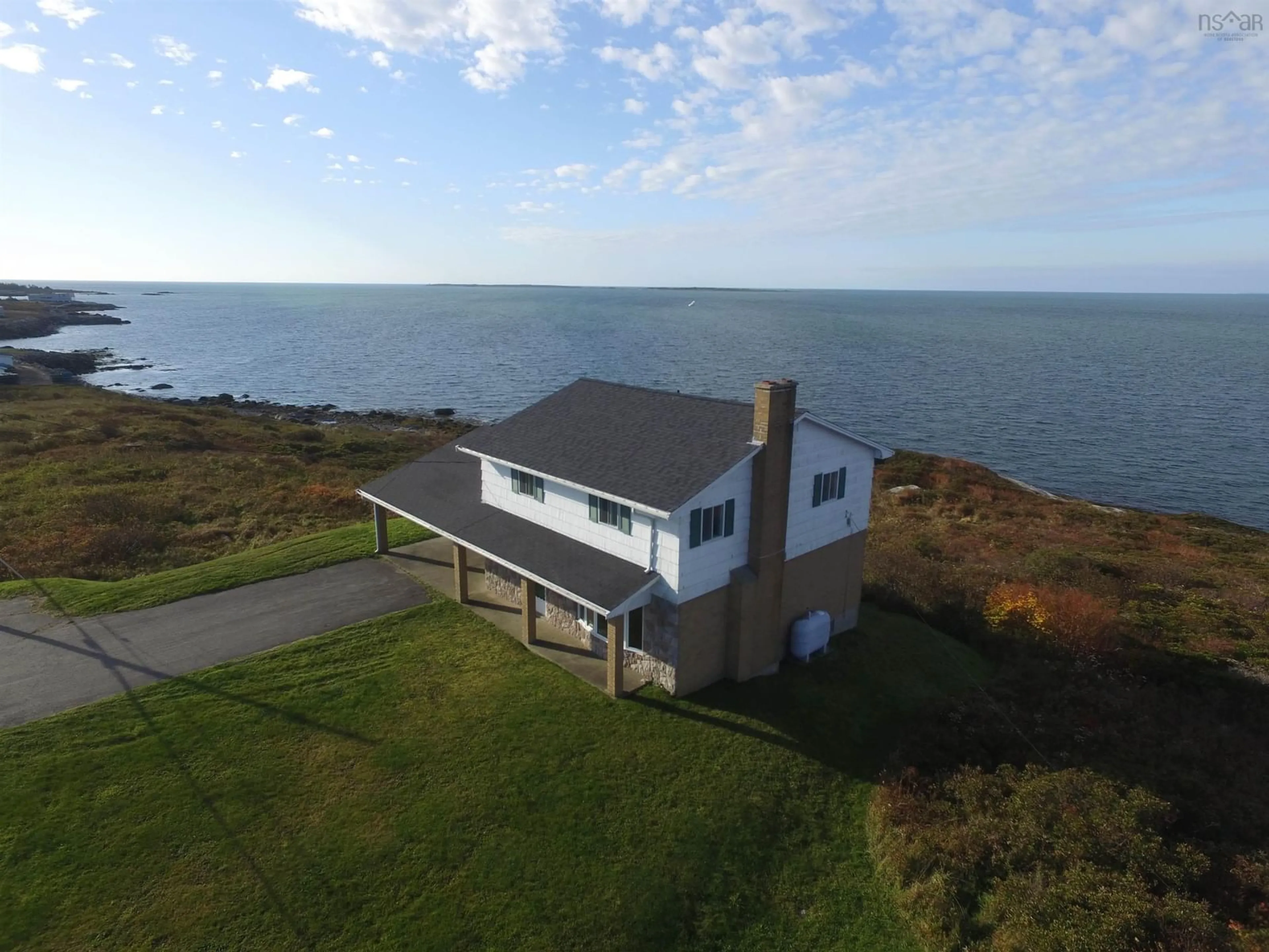 A pic from outside/outdoor area/front of a property/back of a property/a pic from drone, water/lake/river/ocean view for 6175 Highway 3, Lower Woods Harbour Nova Scotia B0W 2E0