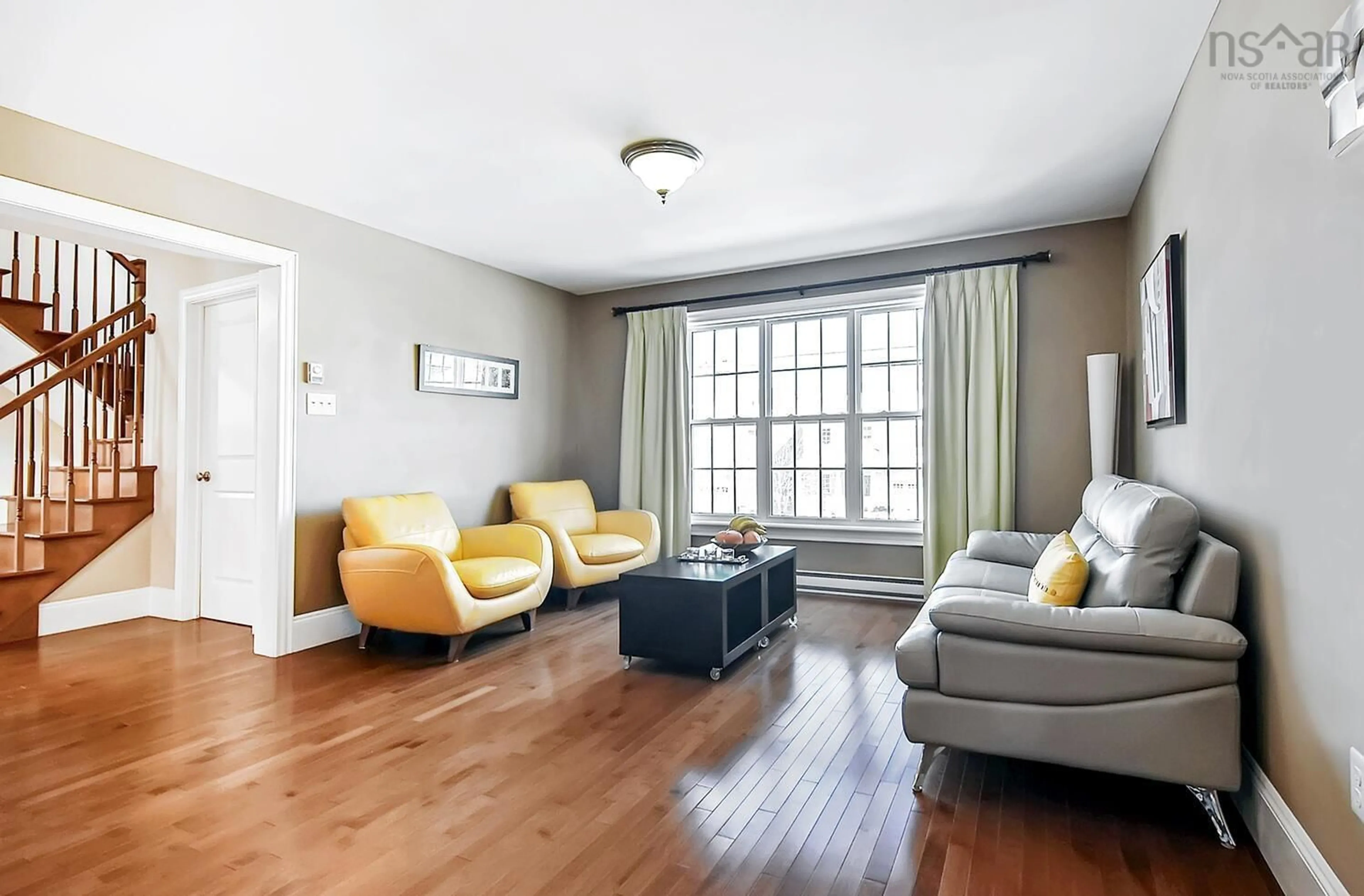 Living room with furniture, wood/laminate floor for 19 Capstone Cres, Bedford Nova Scotia B4B 0H1