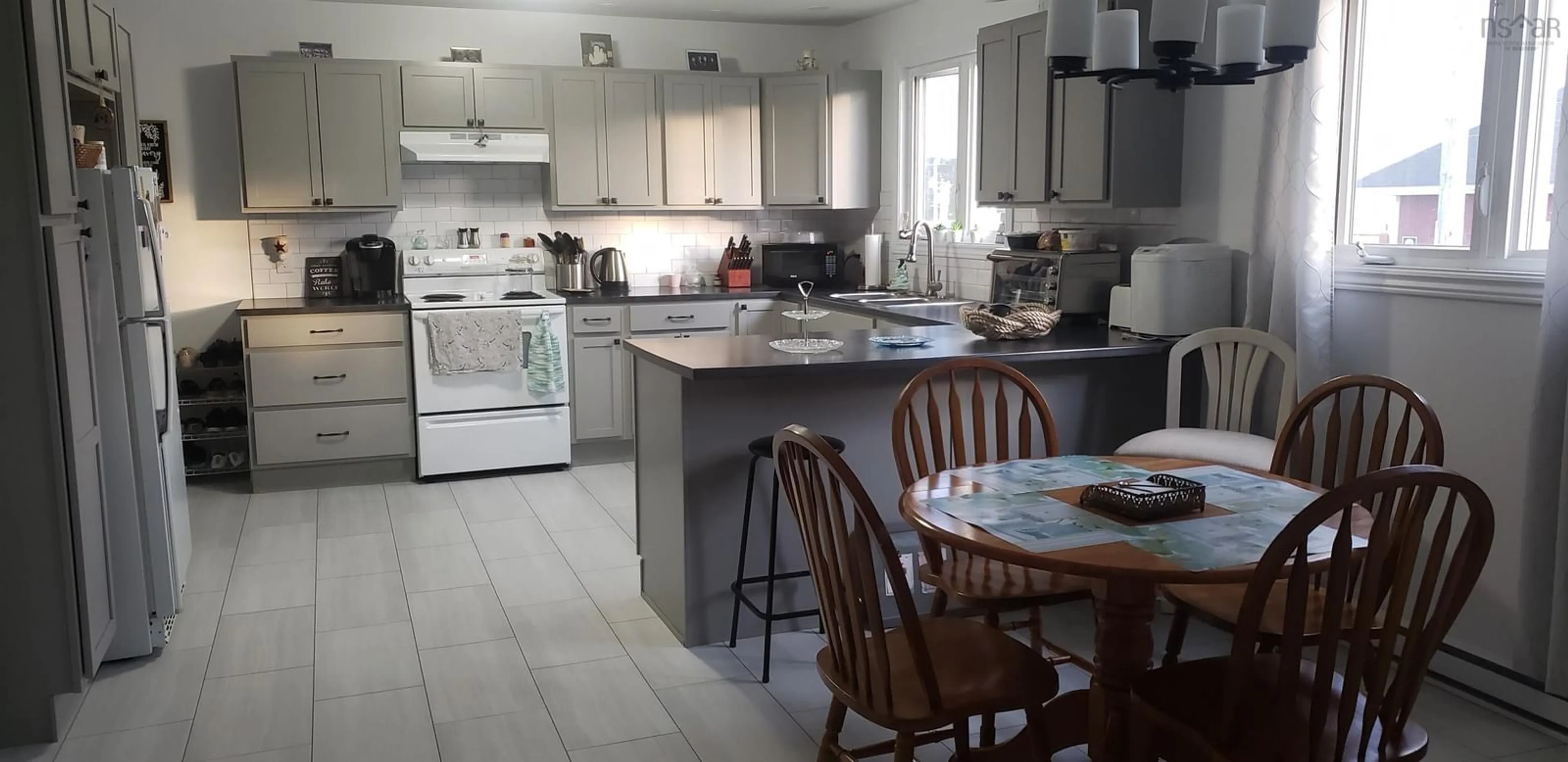 Open concept kitchen, ceramic/tile floor for 11 Toulouse St, St. Peter's Nova Scotia B0E 3B0