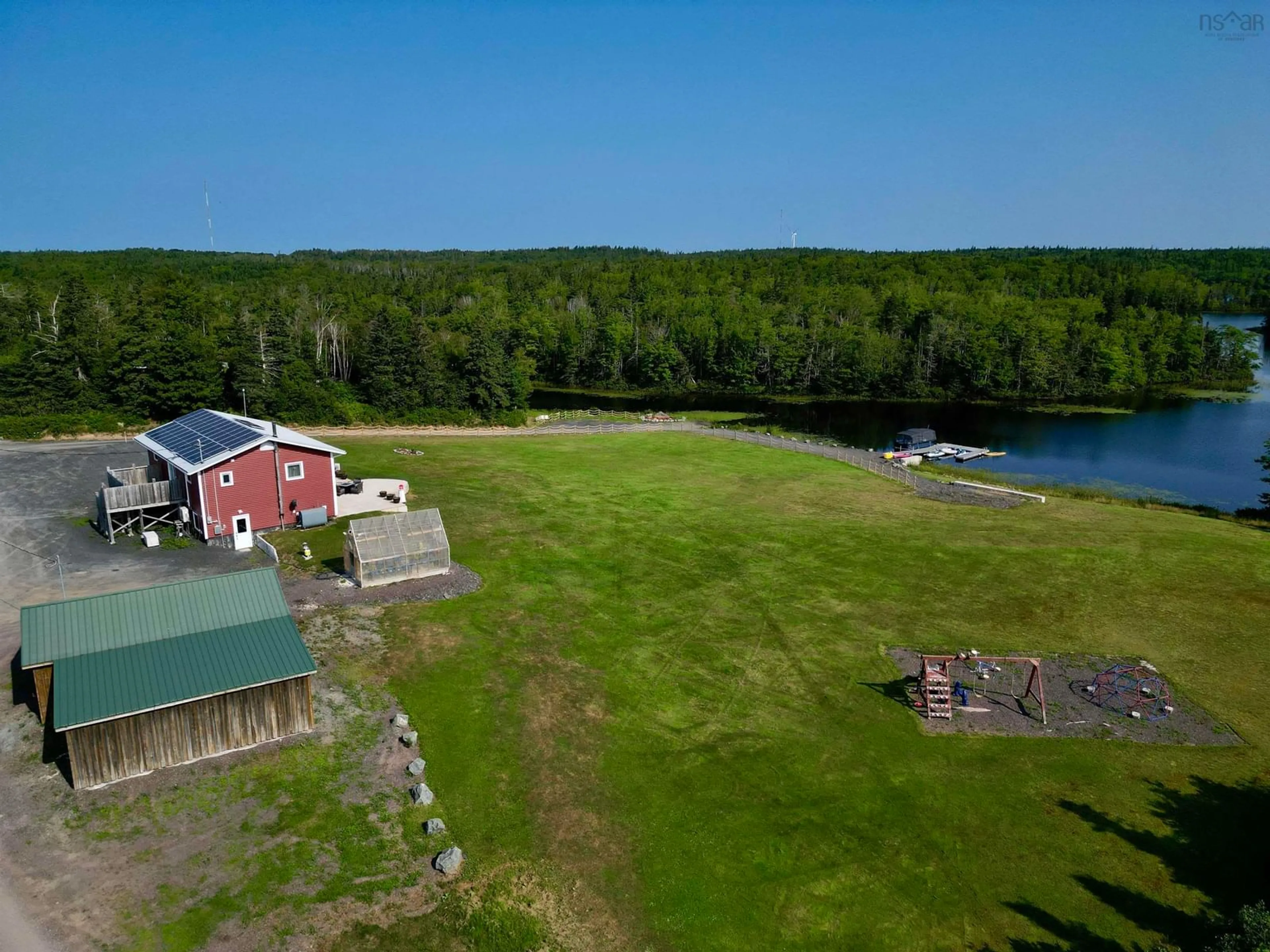 A pic from outside/outdoor area/front of a property/back of a property/a pic from drone, water/lake/river/ocean view for 207 Lake Rd, West Arichat Nova Scotia B0E 3J0