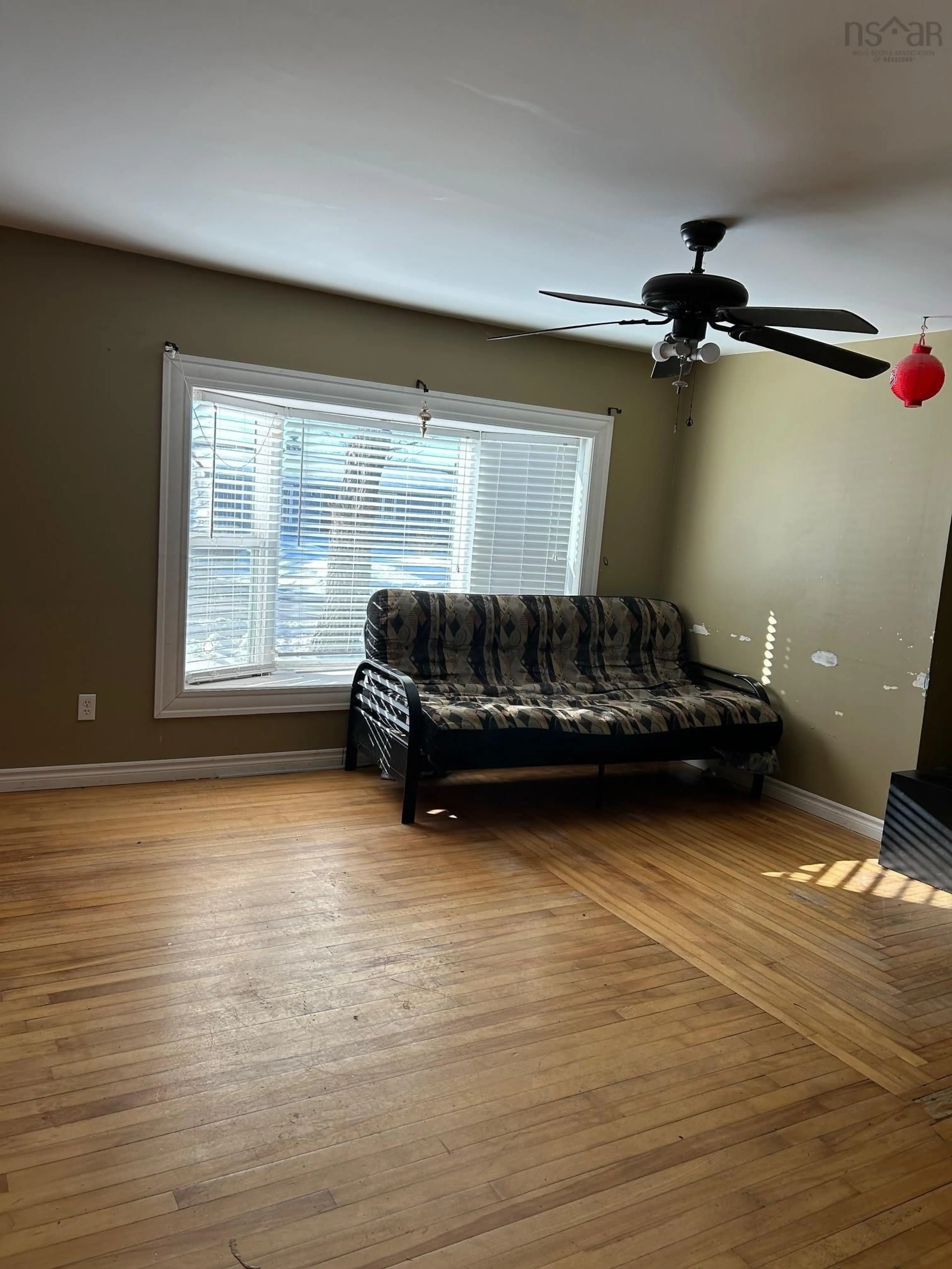 Living room with furniture, wood/laminate floor for 309 Truro Heights Rd, Truro Heights Nova Scotia B6L 1X5