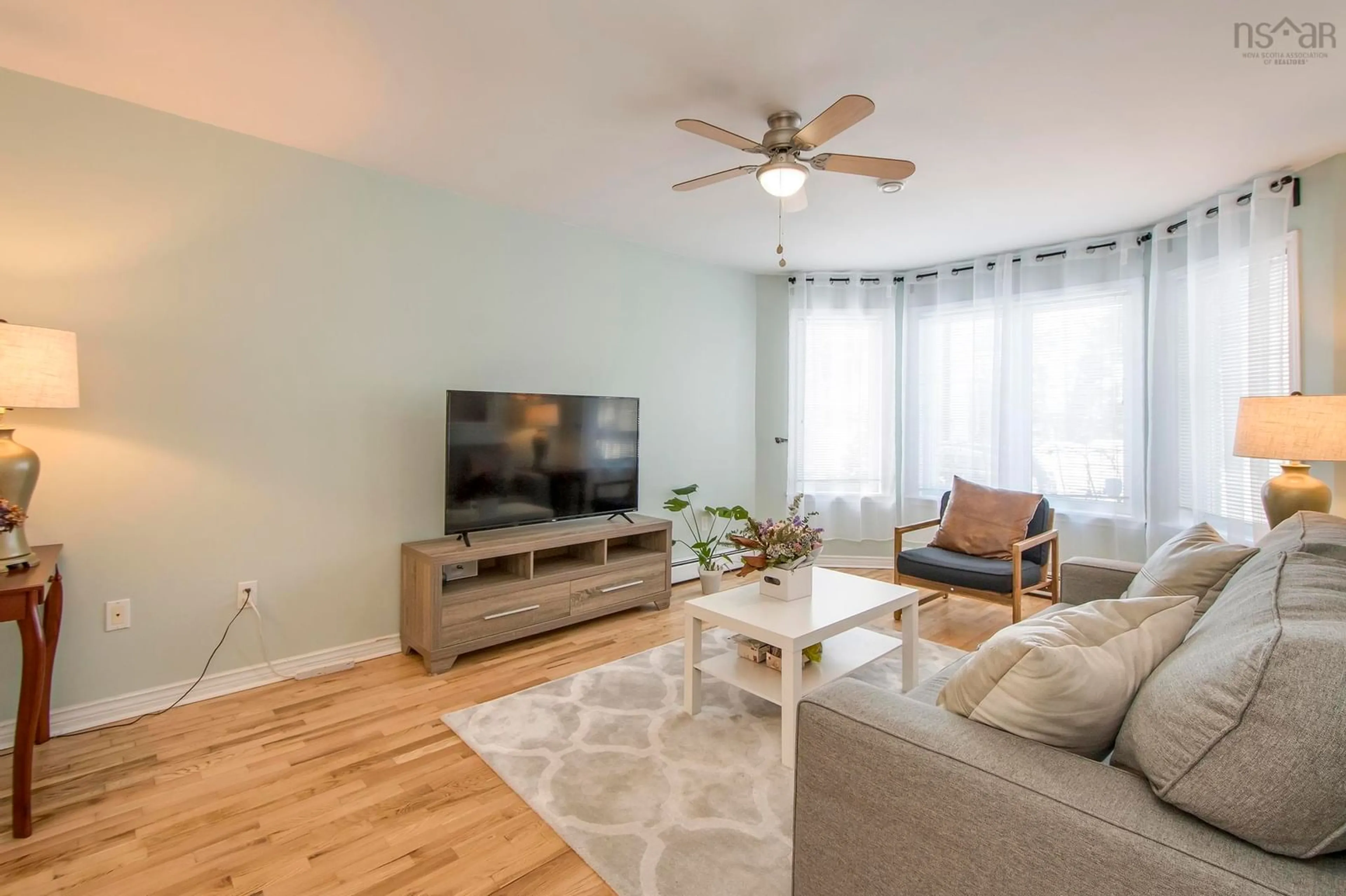 Living room with furniture, wood/laminate floor for 26 James Winfield Lane, Bedford South Nova Scotia B4A 4C3